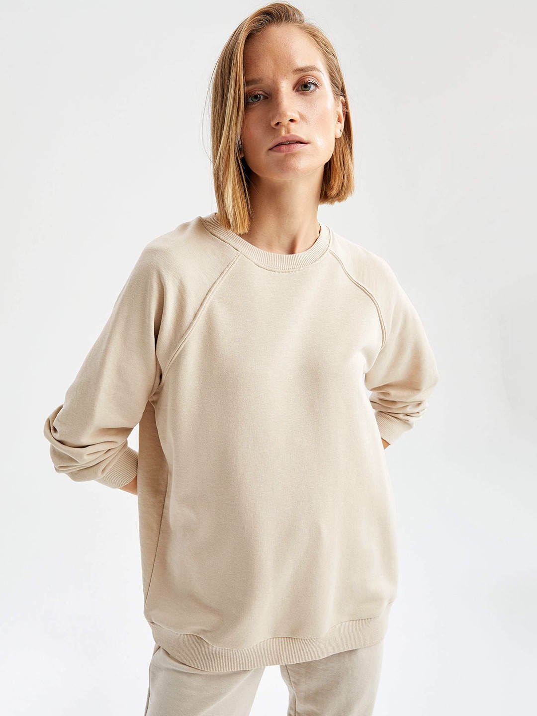 

DeFacto Women Beige Solid Sweatshirt