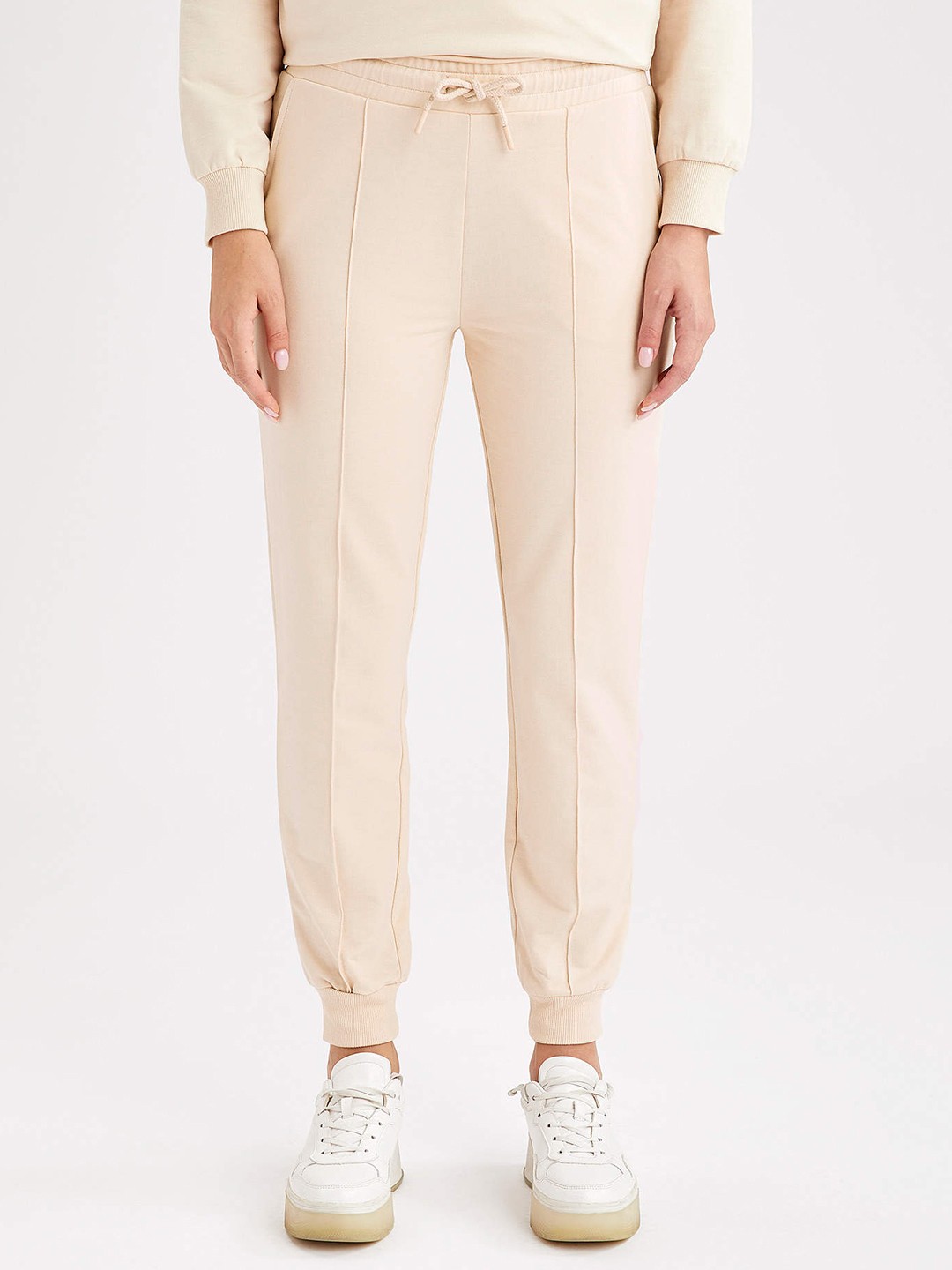 

DeFacto Women Beige Solid Joggers with Line Stitch Detailing