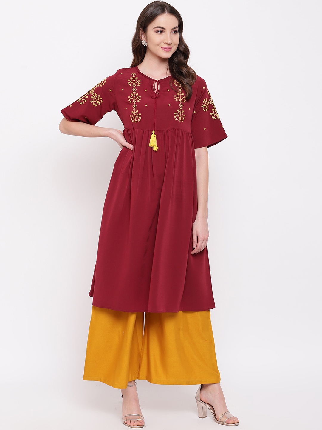 

Napra Women Maroon Geometric Yoke Design Flared Sleeves Thread Work Georgette Kurta