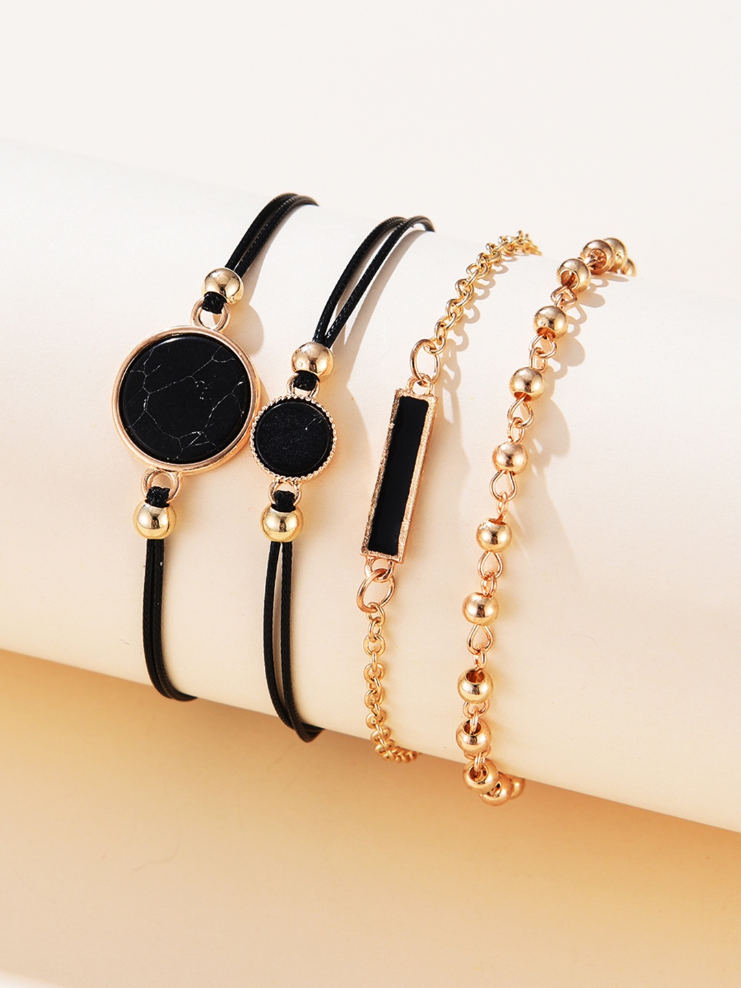 

URBANIC Women Set of 4 Black & Gold-Toned Charm Bracelet