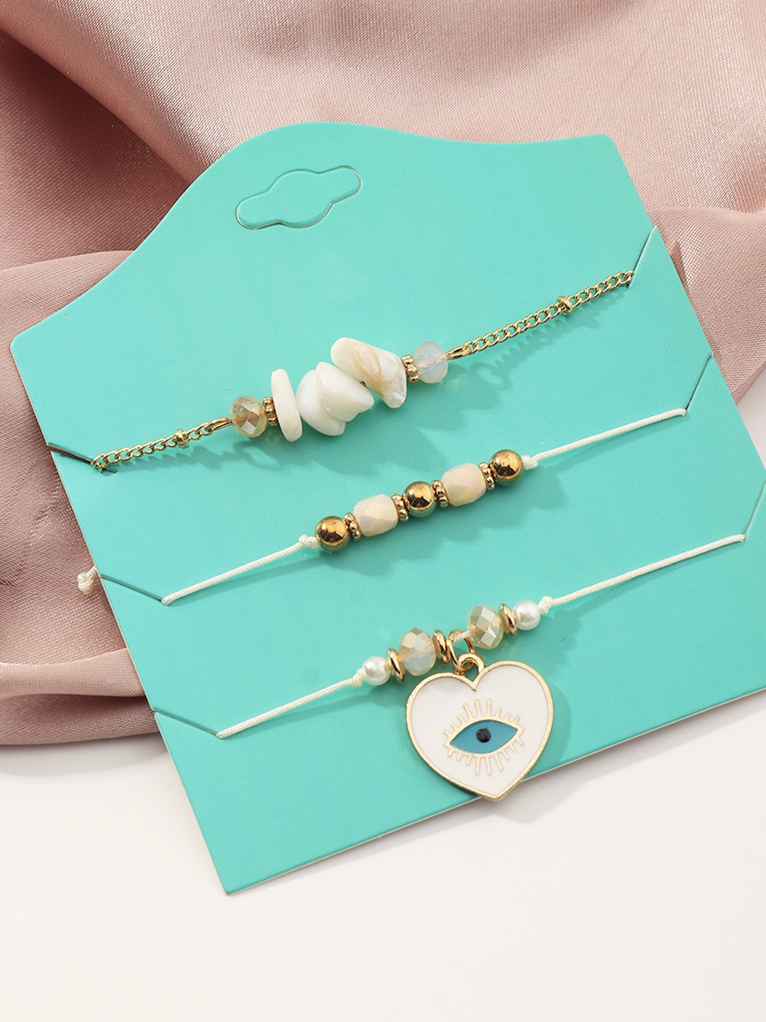 

URBANIC Women Set of 3 White & Gold-Toned Charm Braceletss