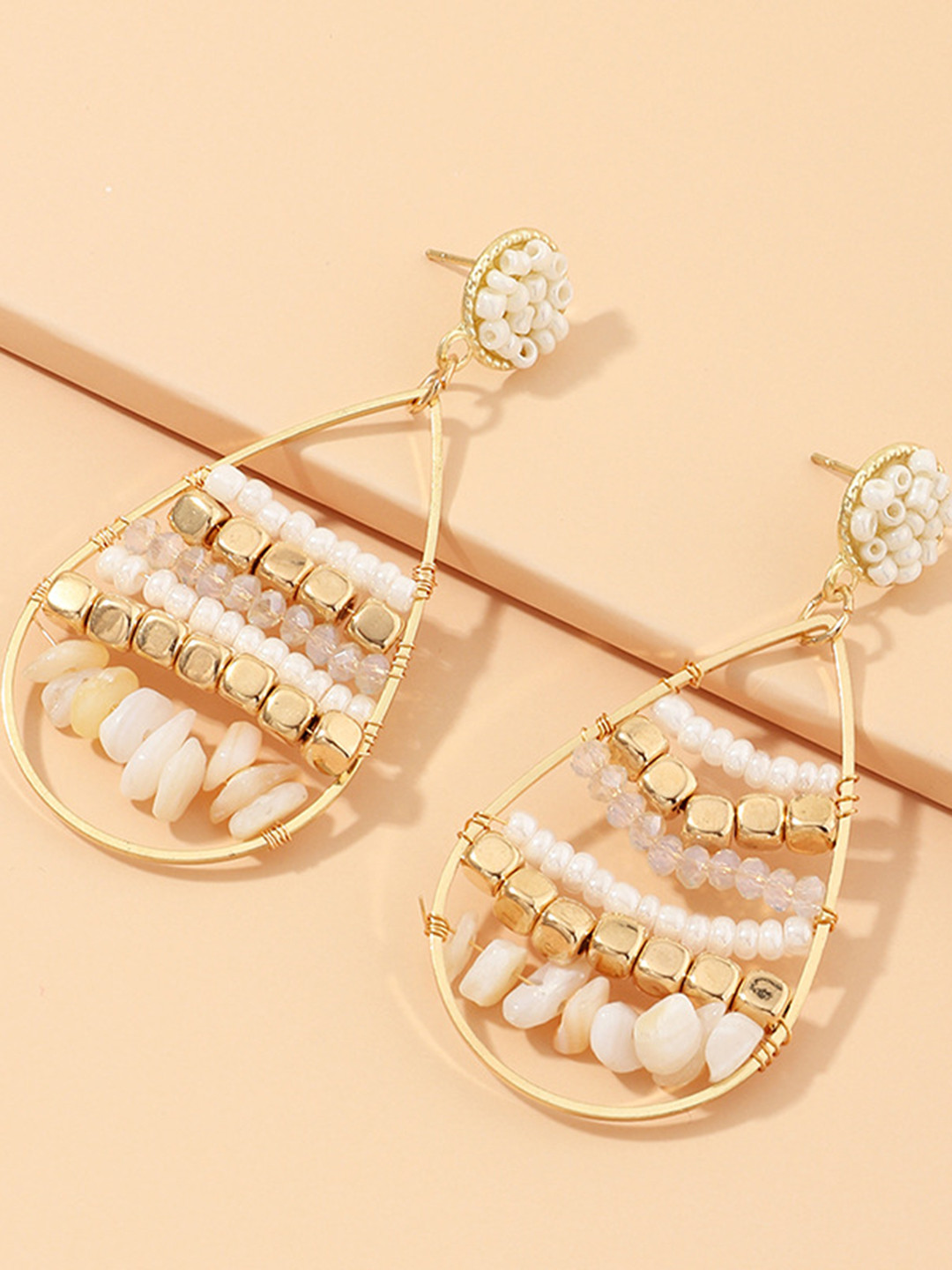 

URBANIC Gold-Toned & Off-White Beaded Teardrop Shaped Drop Earrings