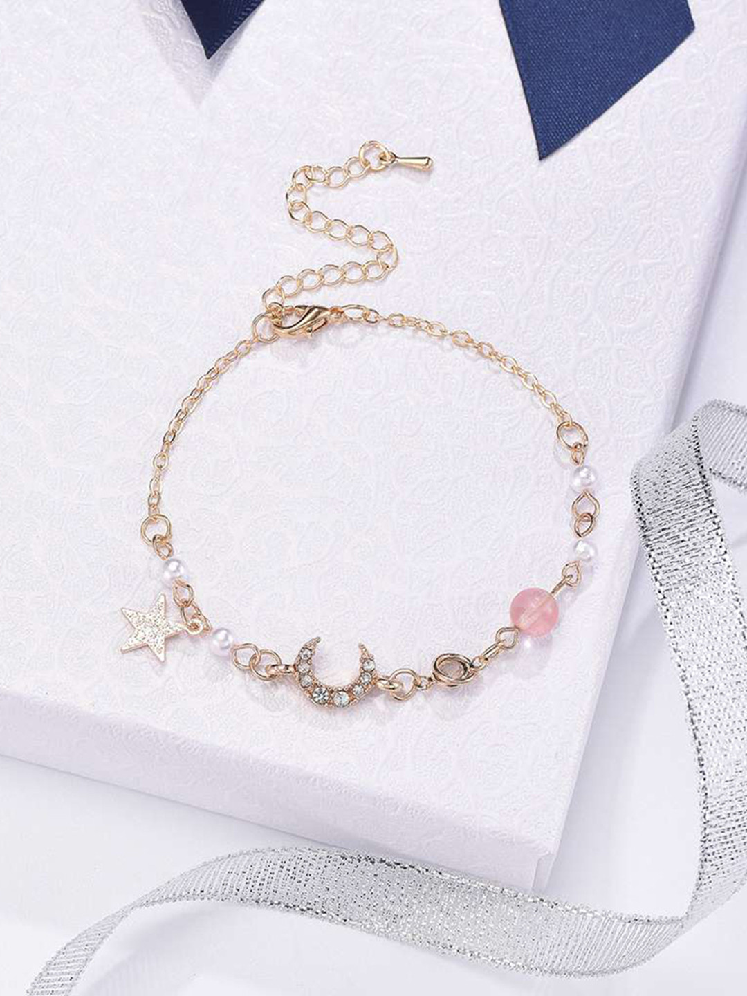 

URBANIC Women Gold-Toned & Off White Charm Bracelet