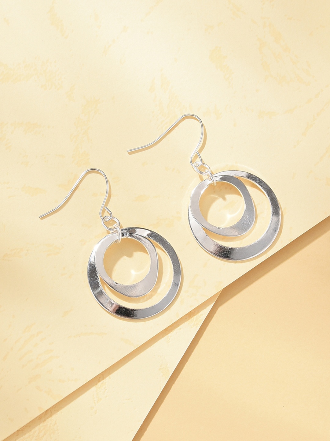 

URBANIC Silver-Toned Circular Drop Earrings