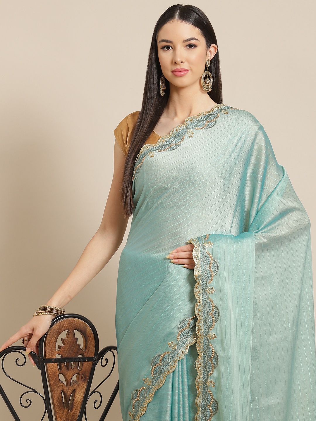 

Anouk Sea Green Striped Beads and Stones Ready to Wear Saree