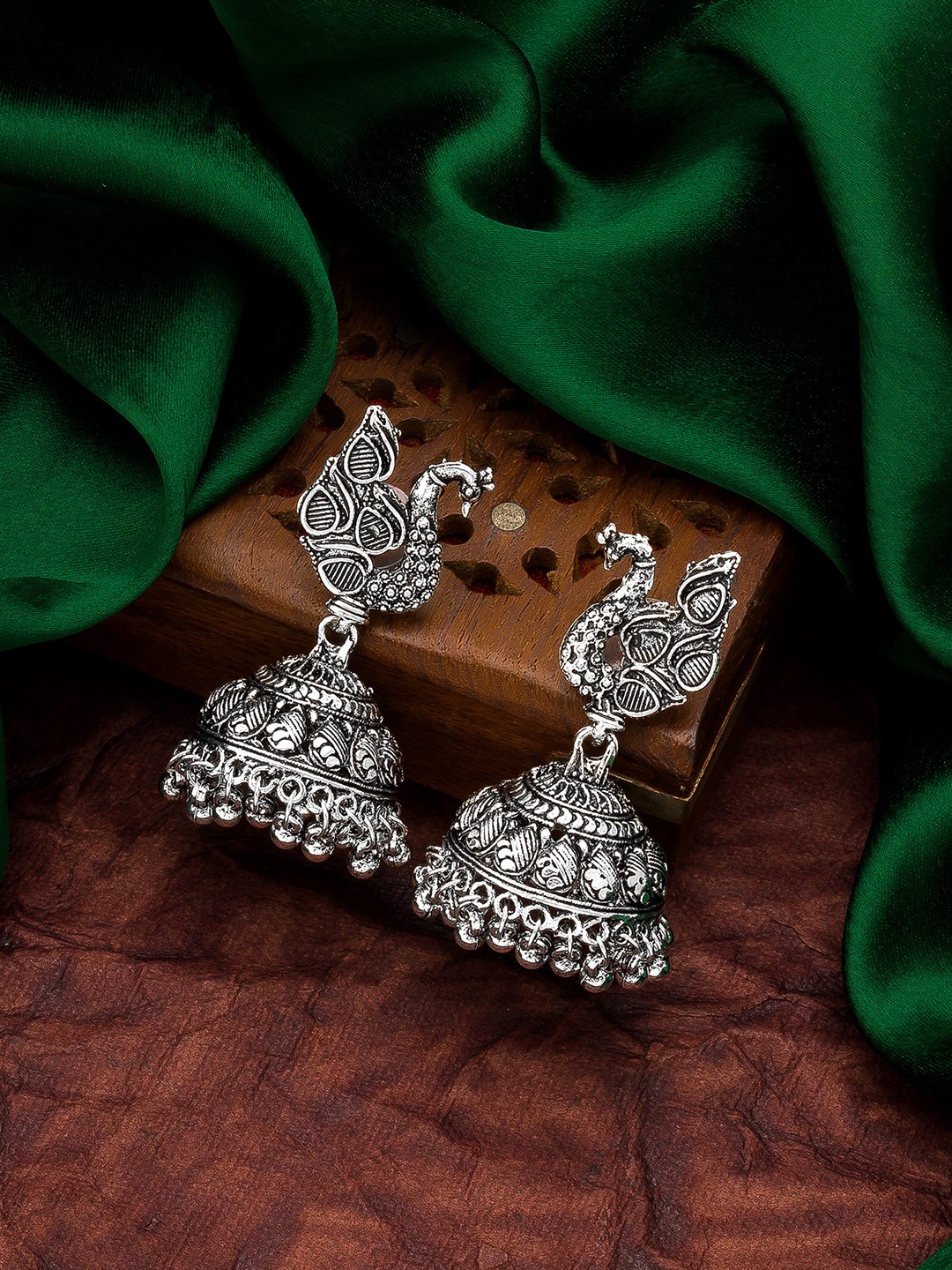 

aadita Silver-Toned Peacock Shaped Jhumkas Earrings