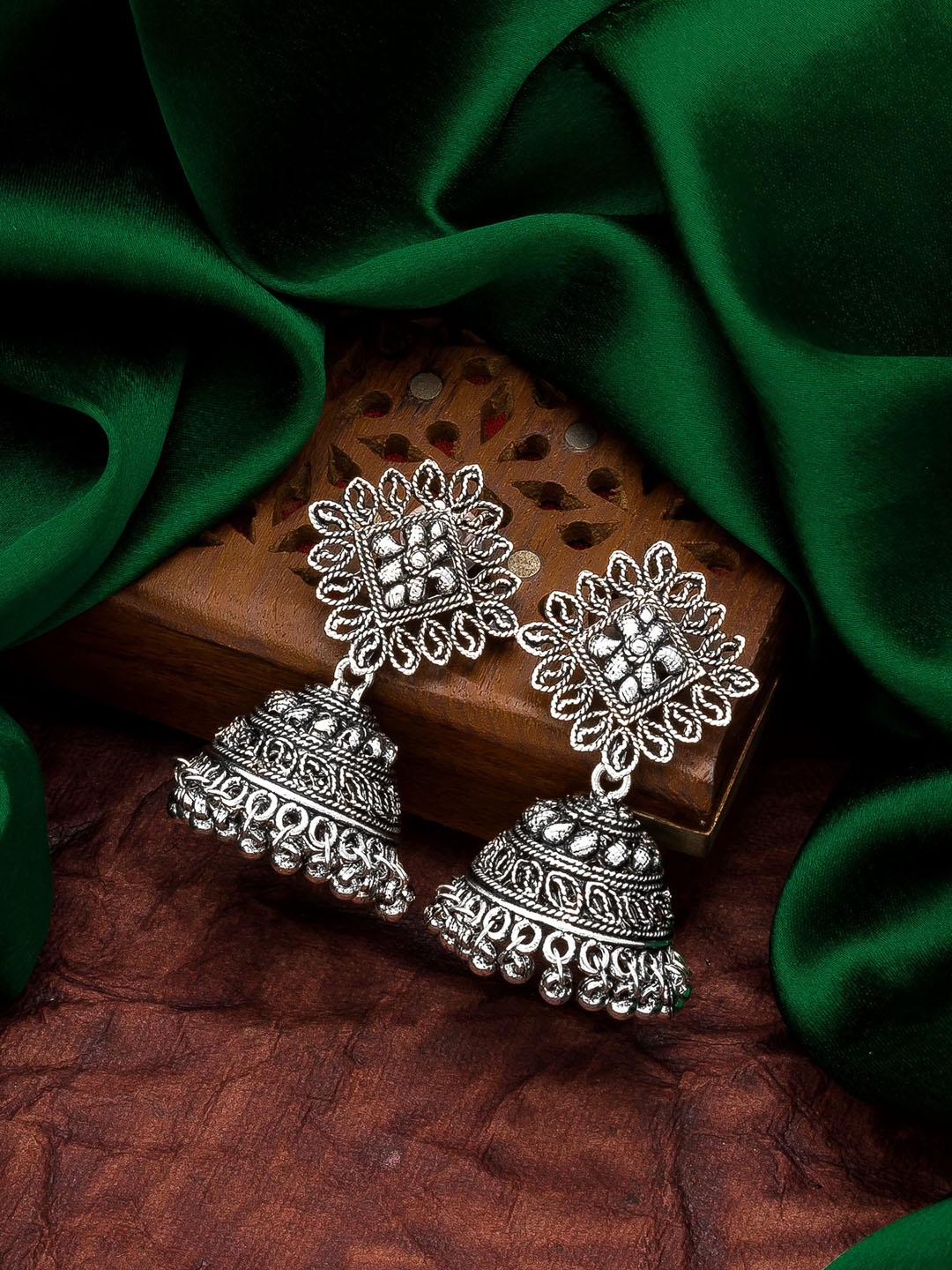 

aadita Silver-Toned German Oxidised Contemporary Jhumkas Earrings