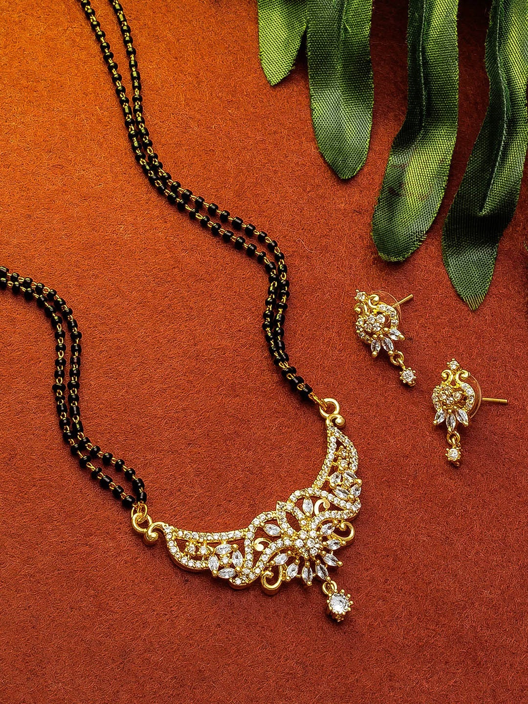

aadita Gold-Plated White & Black Stone-Studded & Beaded Mangalsutra Set