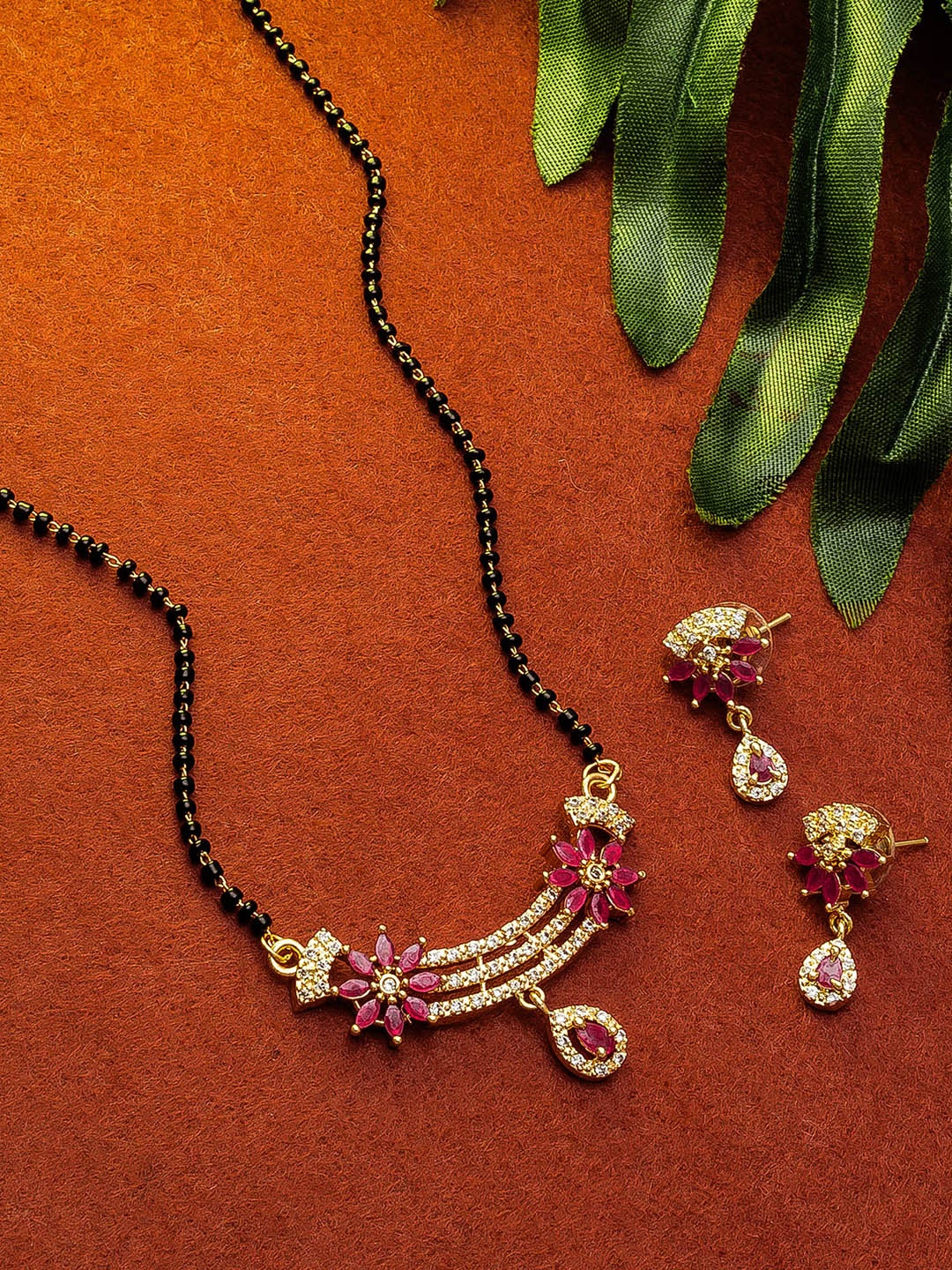 

aadita Gold-Plated Black & White Stone-Studded & Beaded Mangalsutra Set