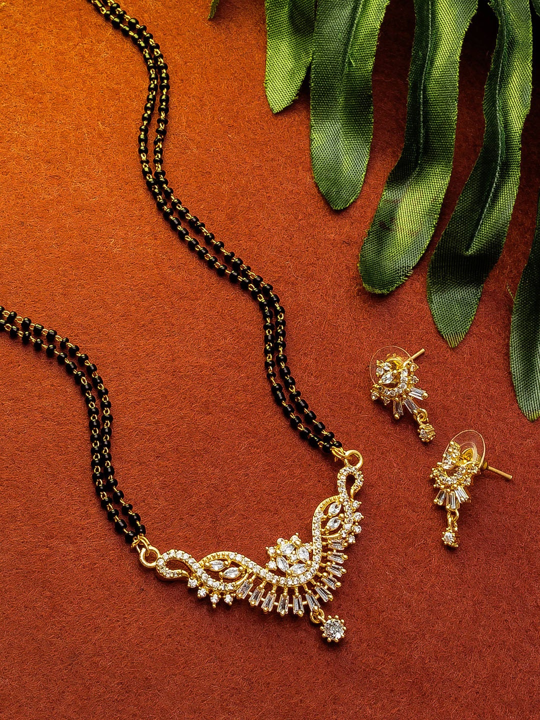 

aadita Gold-Plated Black & White Stone-Studded & Beaded Mangalsutra Set