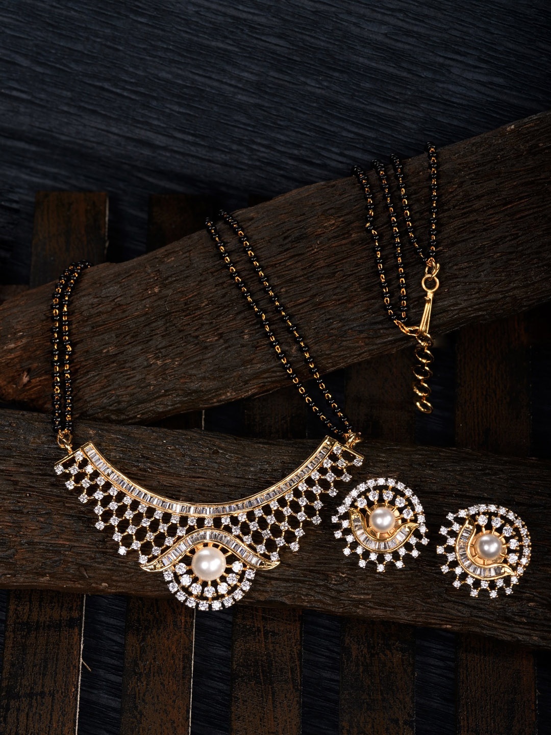 

Saraf RS Jewellery Gold-Plated Black Beaded & White AD Stone-Studded Mangalsutra With Earrings