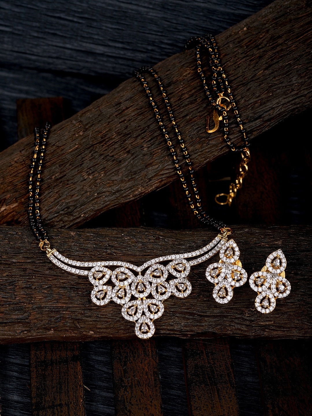 

Saraf RS Jewellery Gold-Plated Black Beaded & White AD Stone-Studded Mangalsutra With Earrings