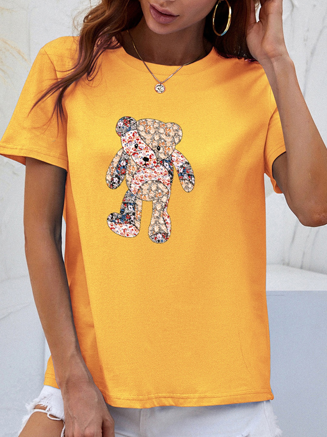 

URBANIC Women Yellow Graphic Printed T-shirt