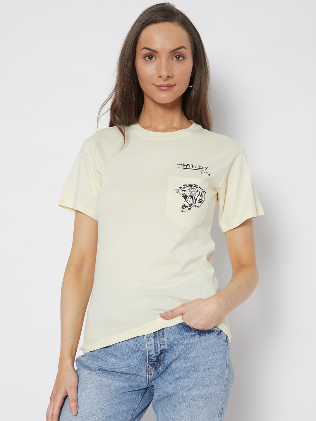 

URBANIC Women Beige & Black Graphic Printed T-shirt
