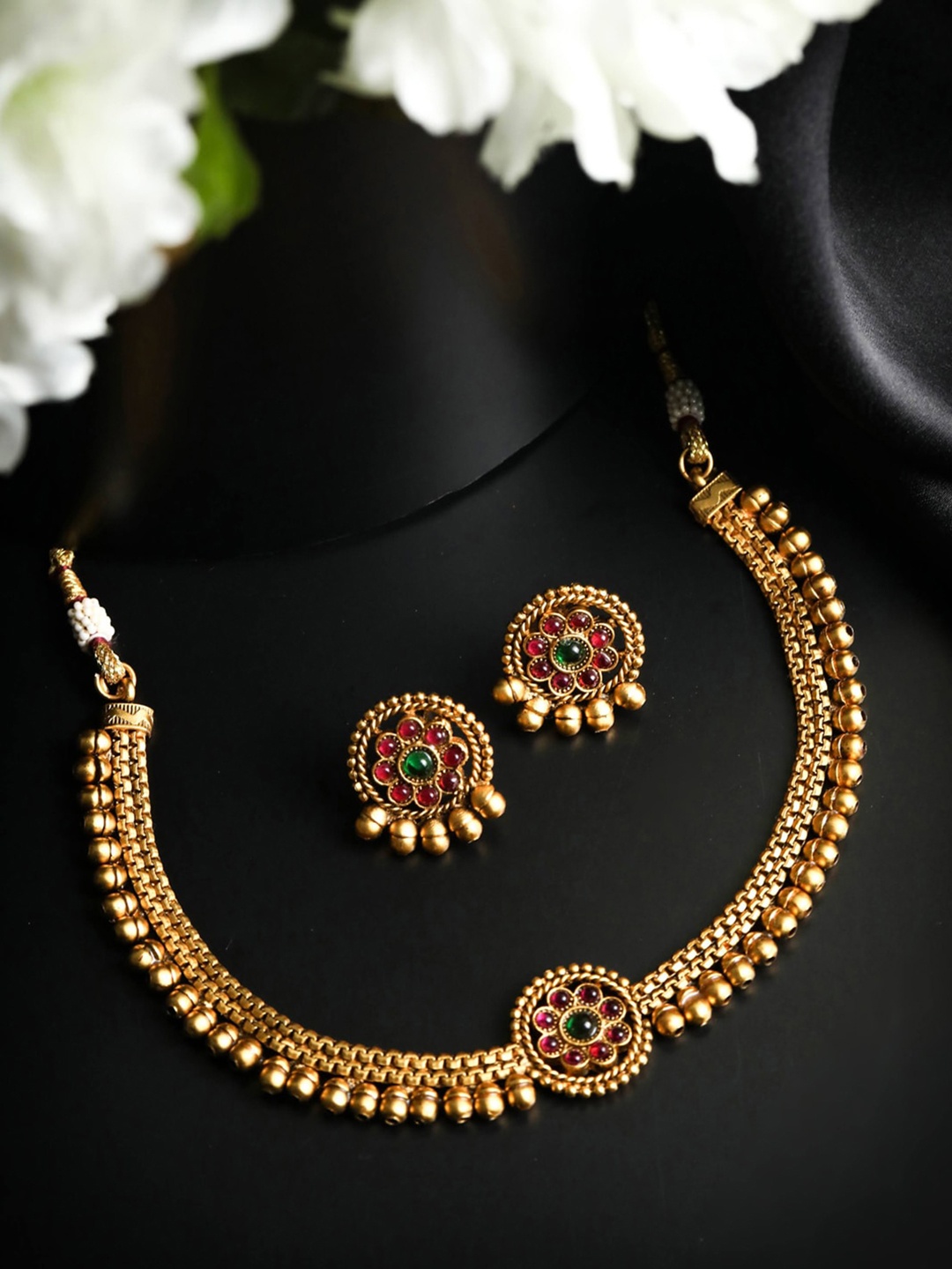 

Priyaasi Gold Plated Red & Green Stone Studded Jewellery Set