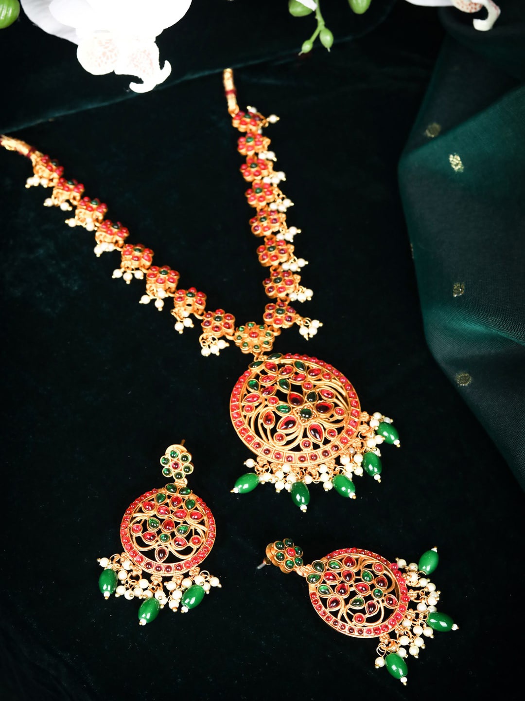

Priyaasi Gold-Plated Green & Red Ruby Kemp Stone Studded & Beaded Jewellery Set