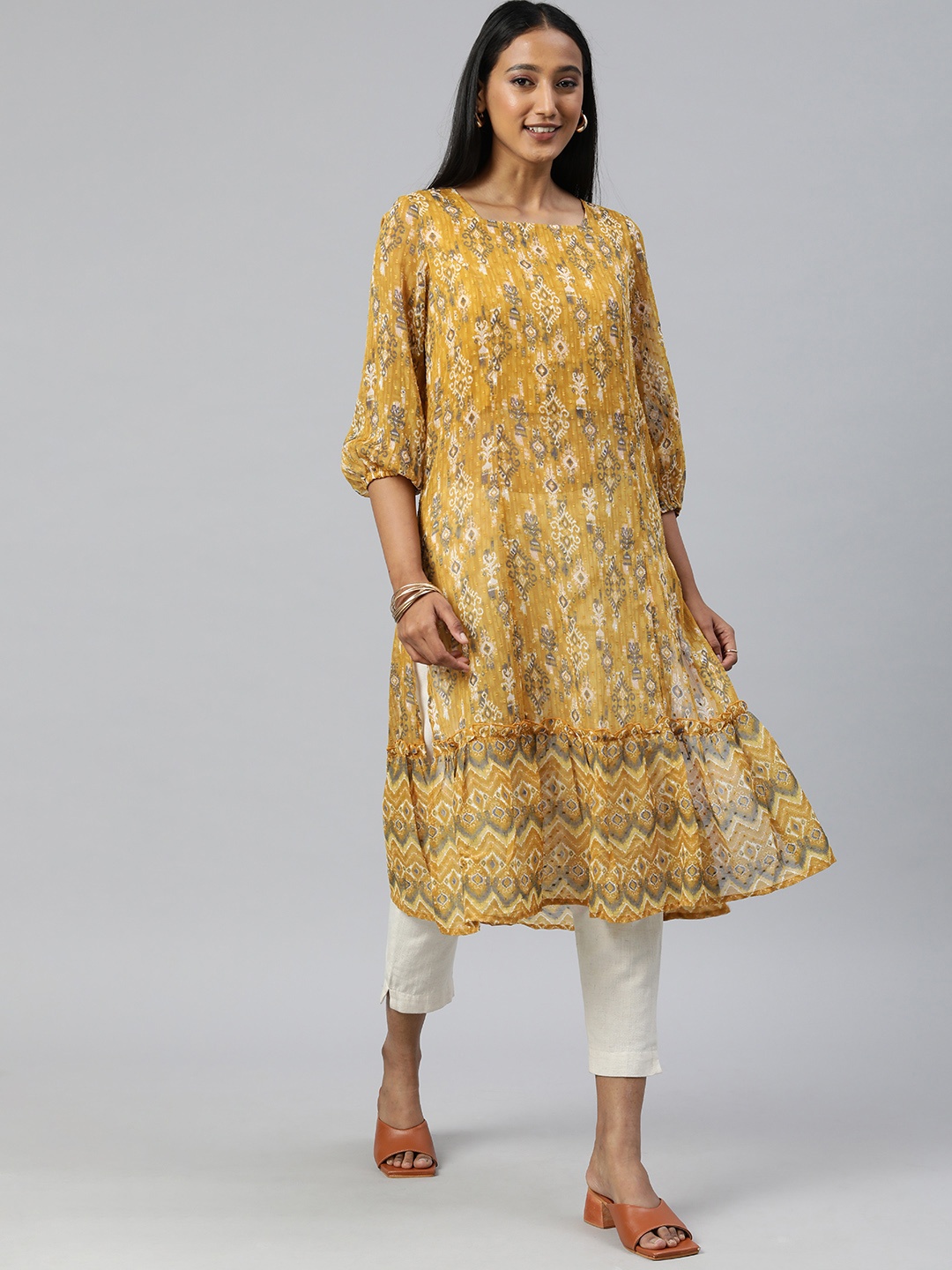 

Global Desi Women Mustard Yellow Ethnic Motifs Printed Tiered Kurta