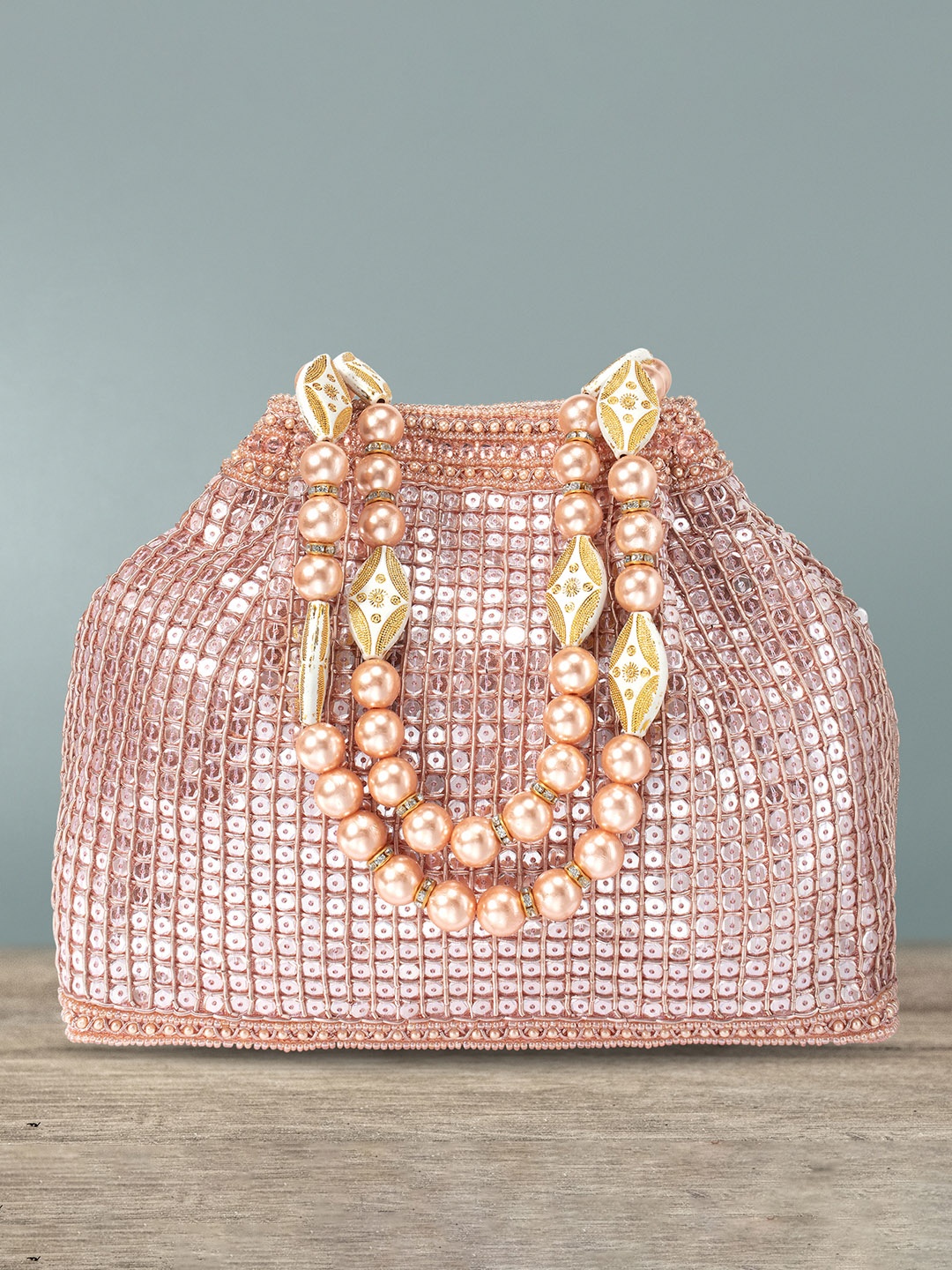 

Peora Rose Gold Embellished Potli Clutch