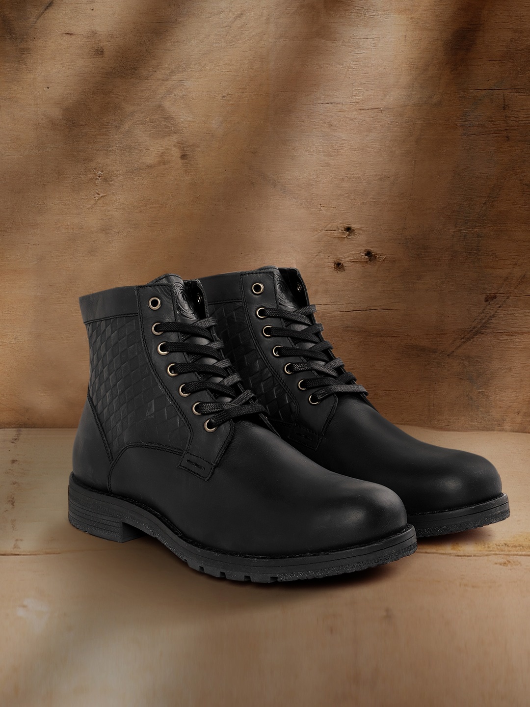 

The Roadster Lifestyle Co Men Black Solid Mid-Top Leather Flat Boots with Textured Detail