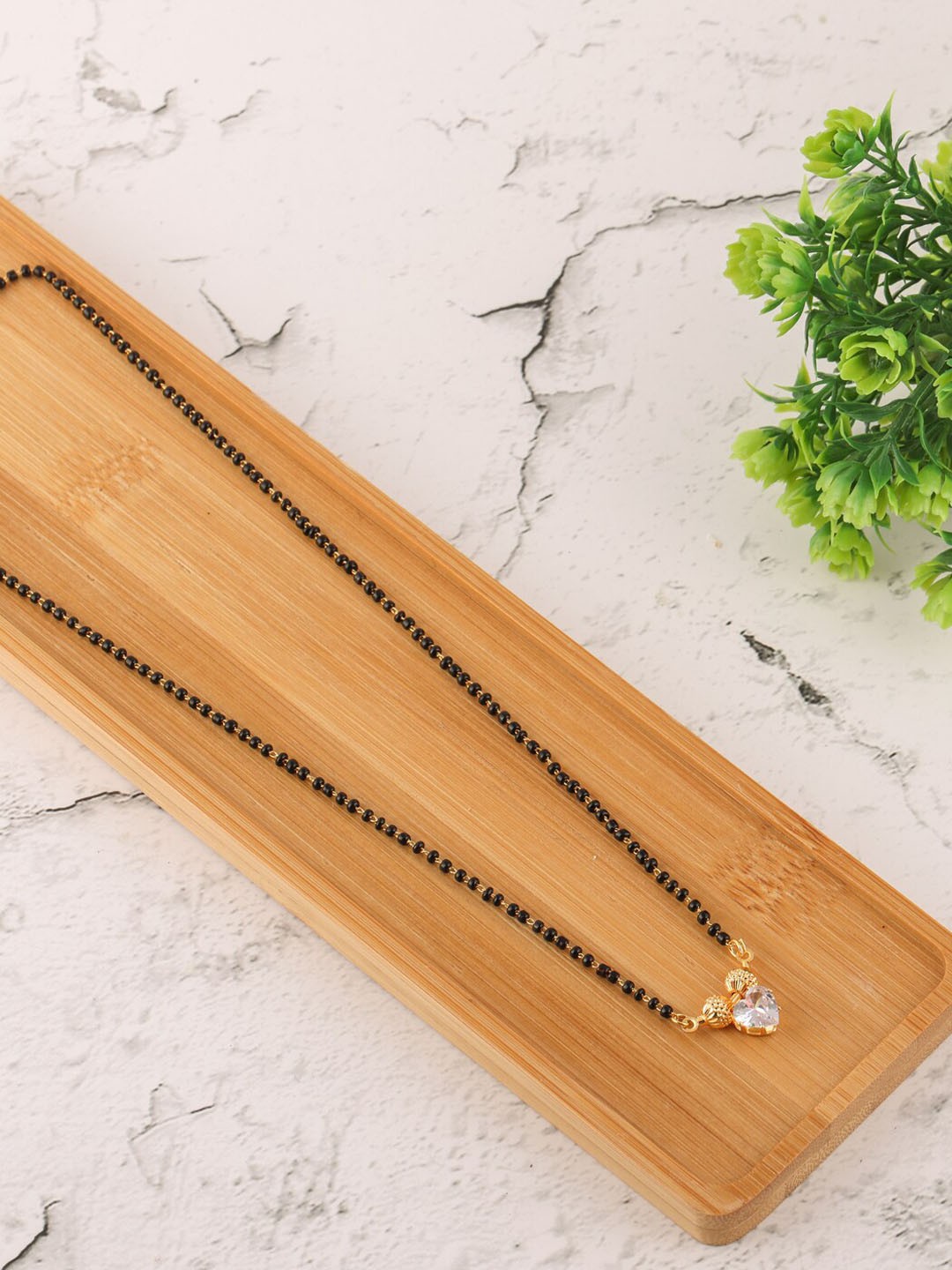 

Brandsoon Gold-Plated & White Stone Studded & Black Beaded Mangalsutra