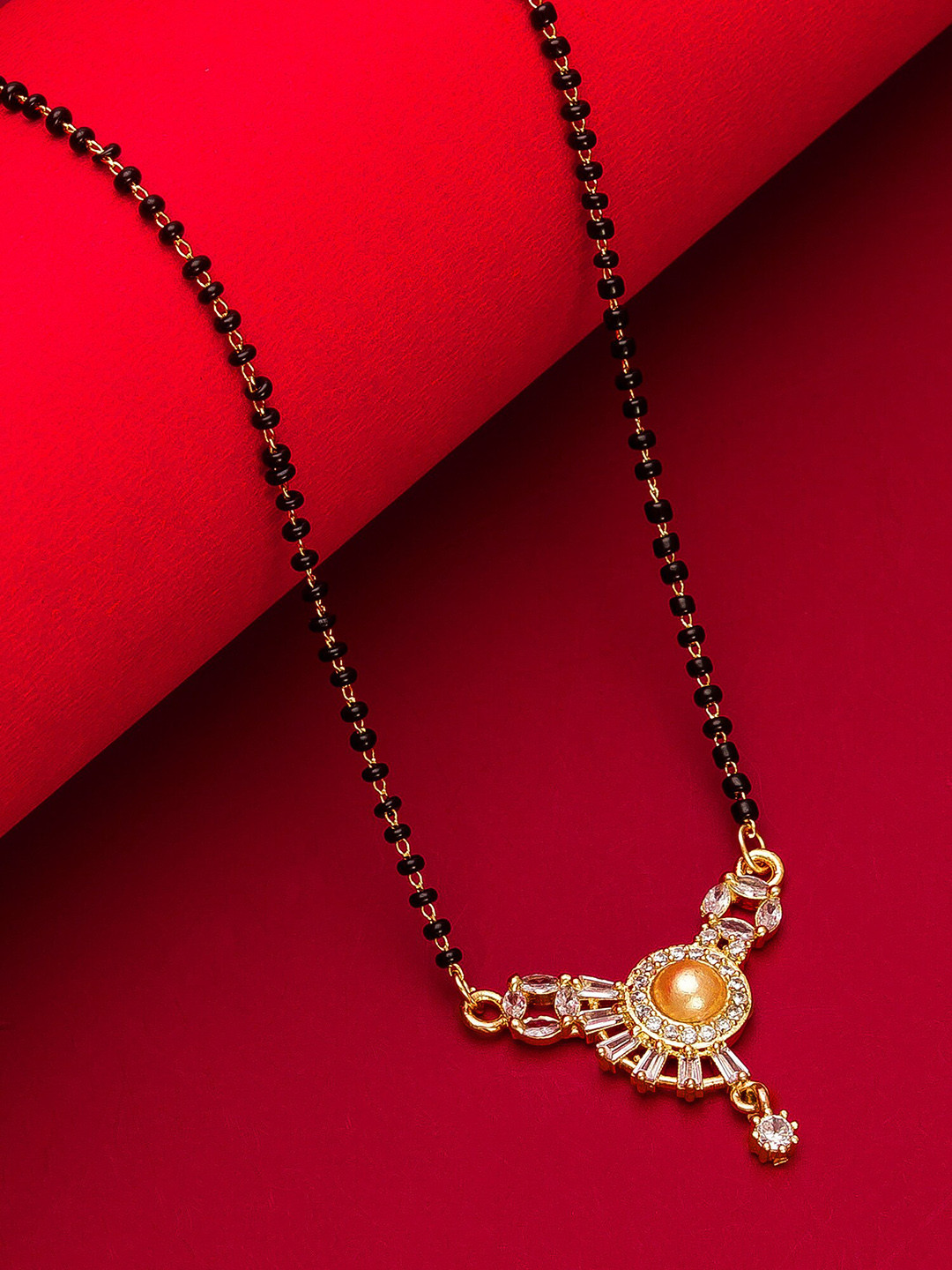 

aadita Woman Gold-Plated Black Beaded & White Stone-Studded Mangalsutra