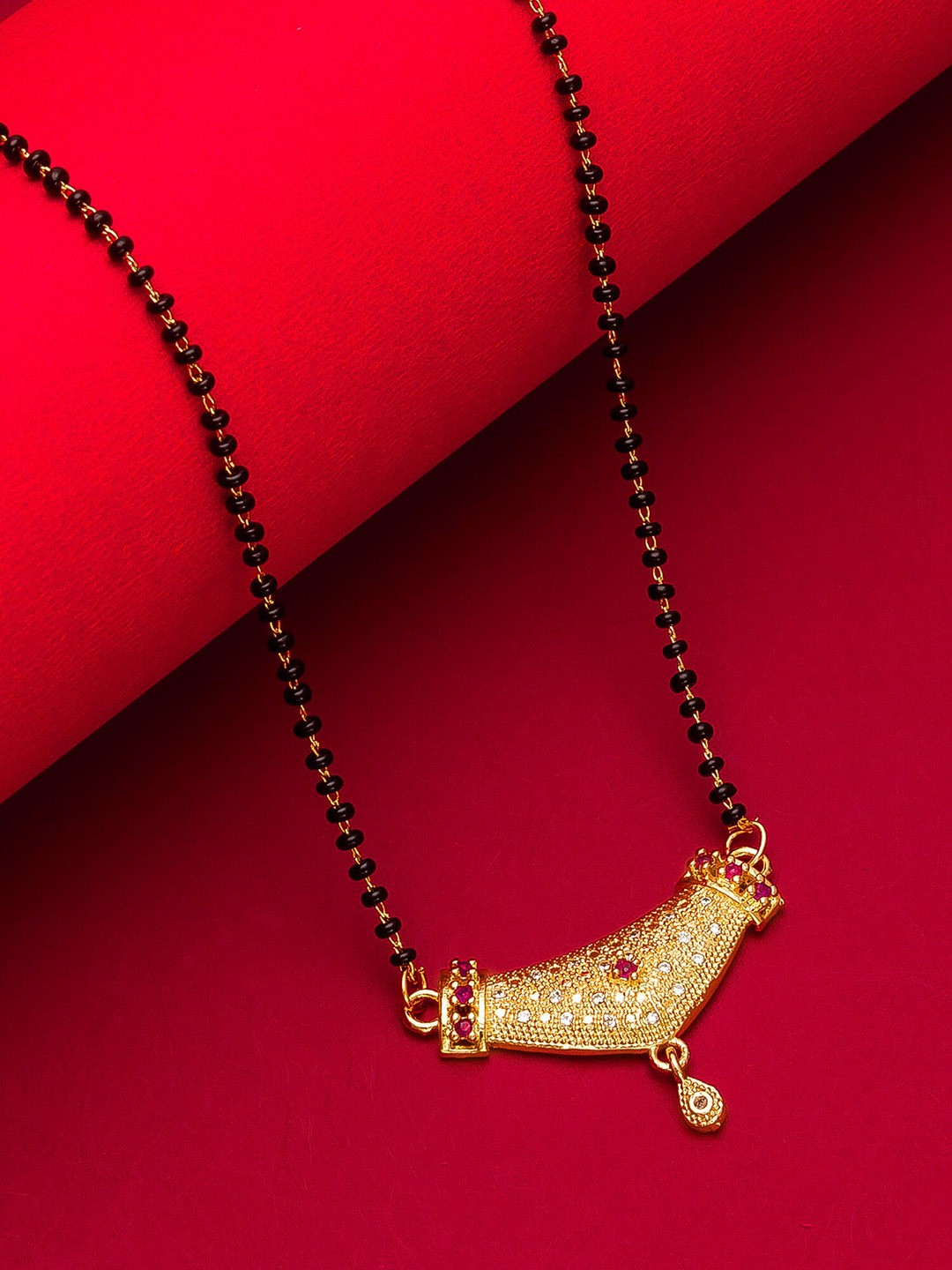 

aadita Woman Gold-Plated Black Beaded & White Stone-Studded Mangalsutra
