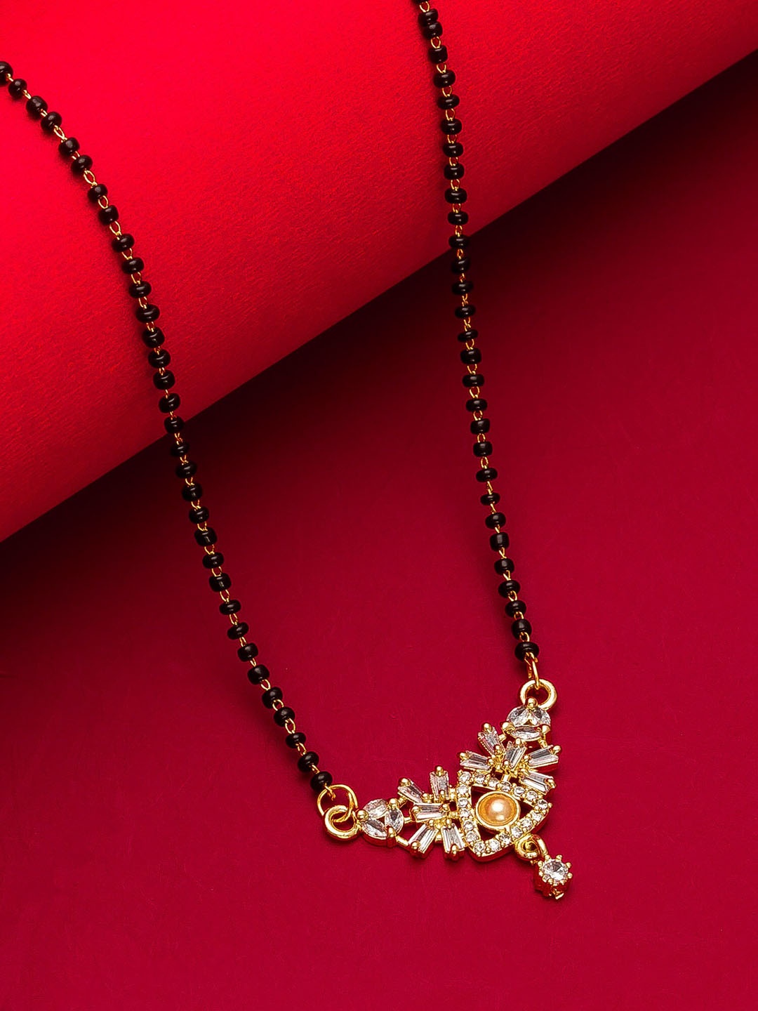 aadita Woman Gold-Plated Black Beaded & White Stone-Studded Mangalsutra