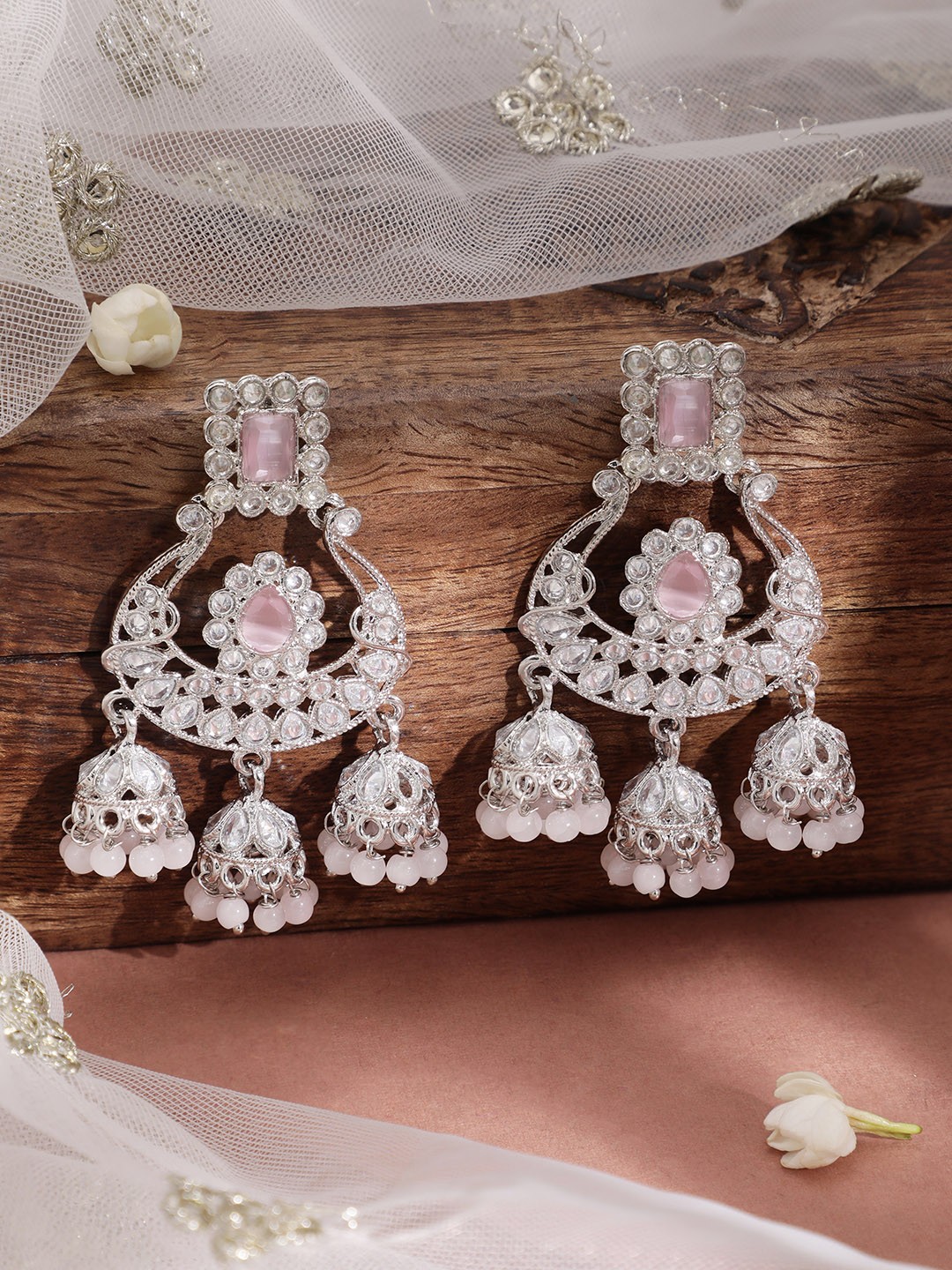 

Rubans Silver-Toned & Pink AD Studded Crescent Shaped Chandbali Earrings
