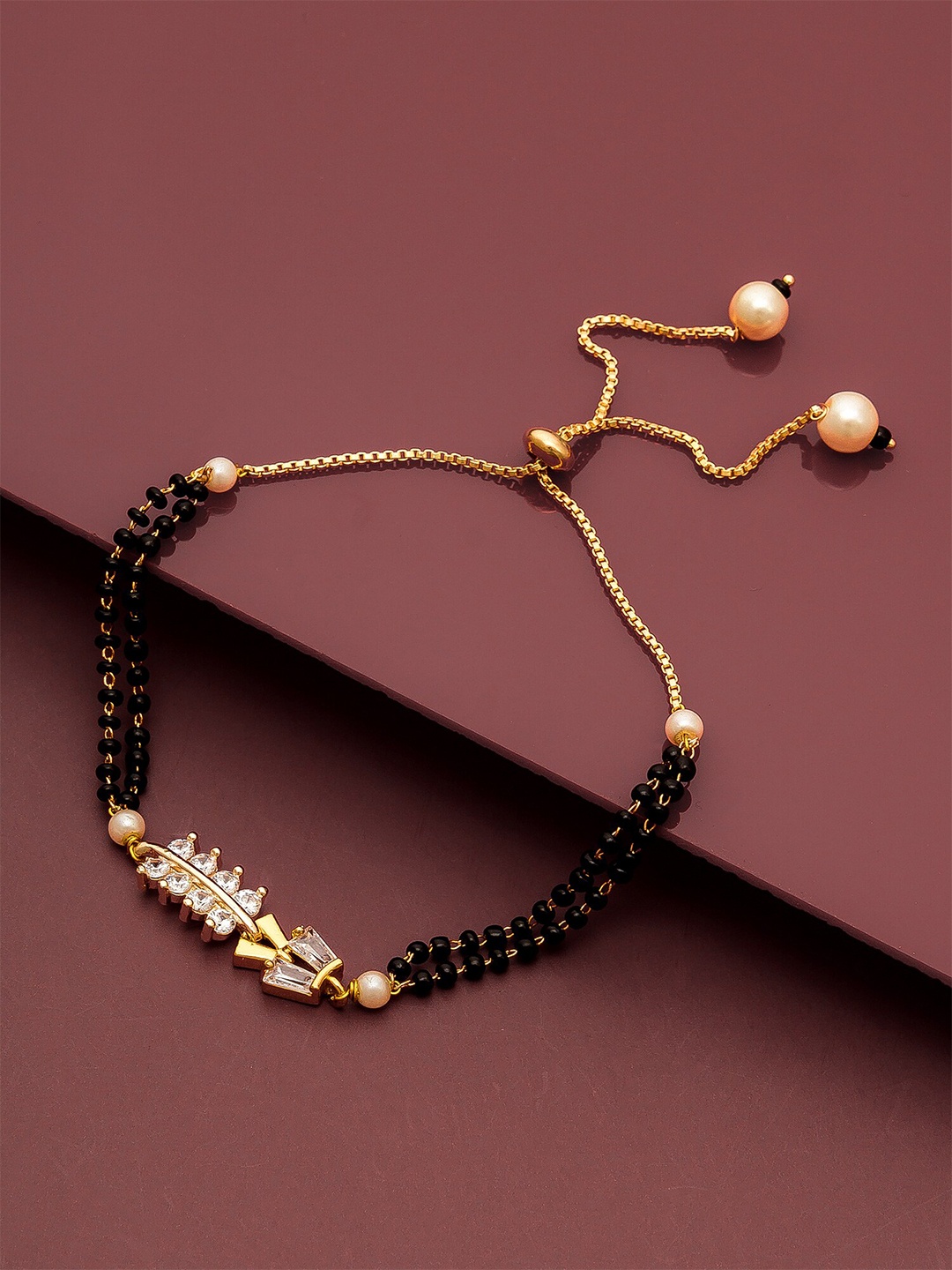 

aadita Women Gold & Black Brass American Diamond Gold-Plated Link Bracelet