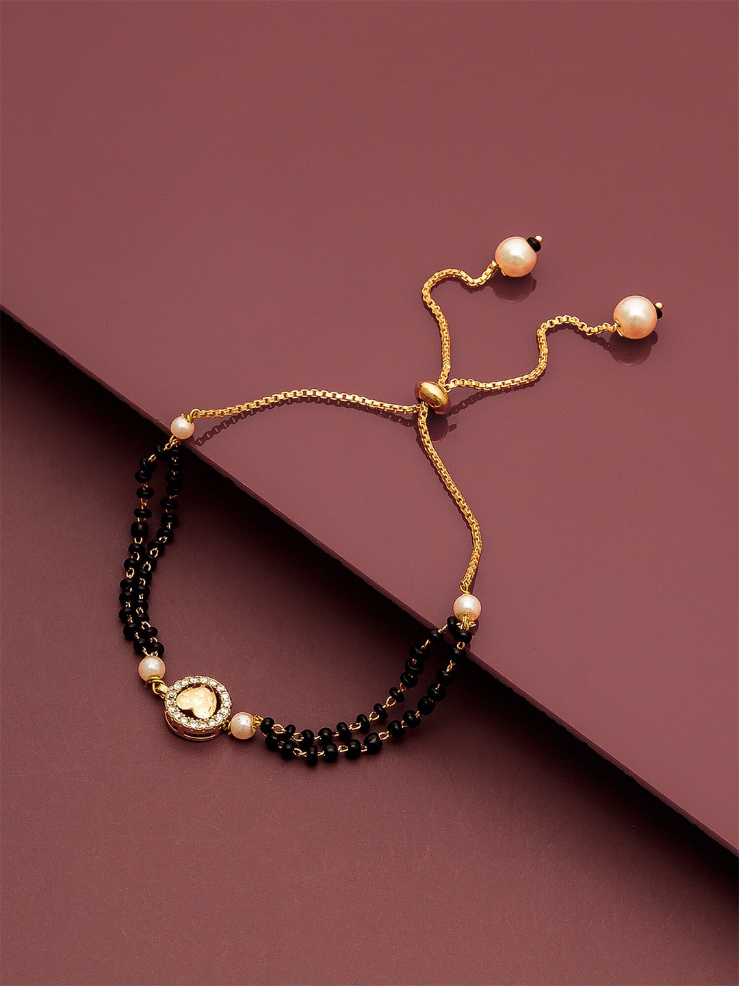 

aadita Women Gold-Toned & Black Beaded Hand Mangalsutra Bracelet