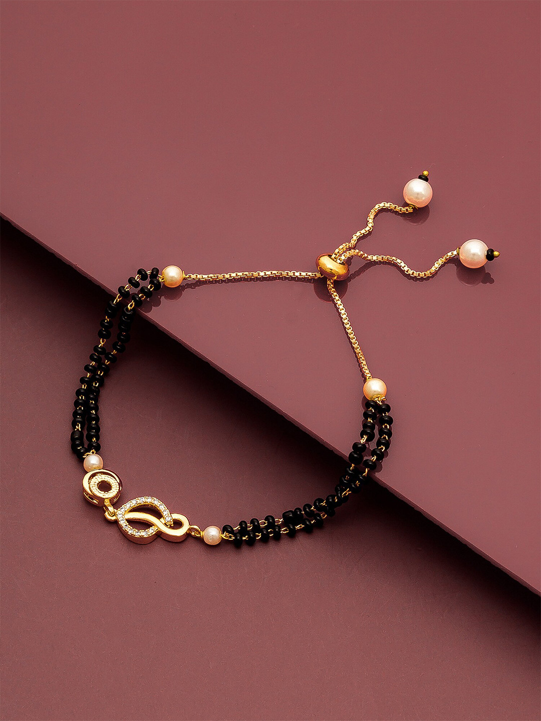 

aadita Women Gold-Toned & Black Brass American Diamond Gold-Plated Mangalsutra Bracelet