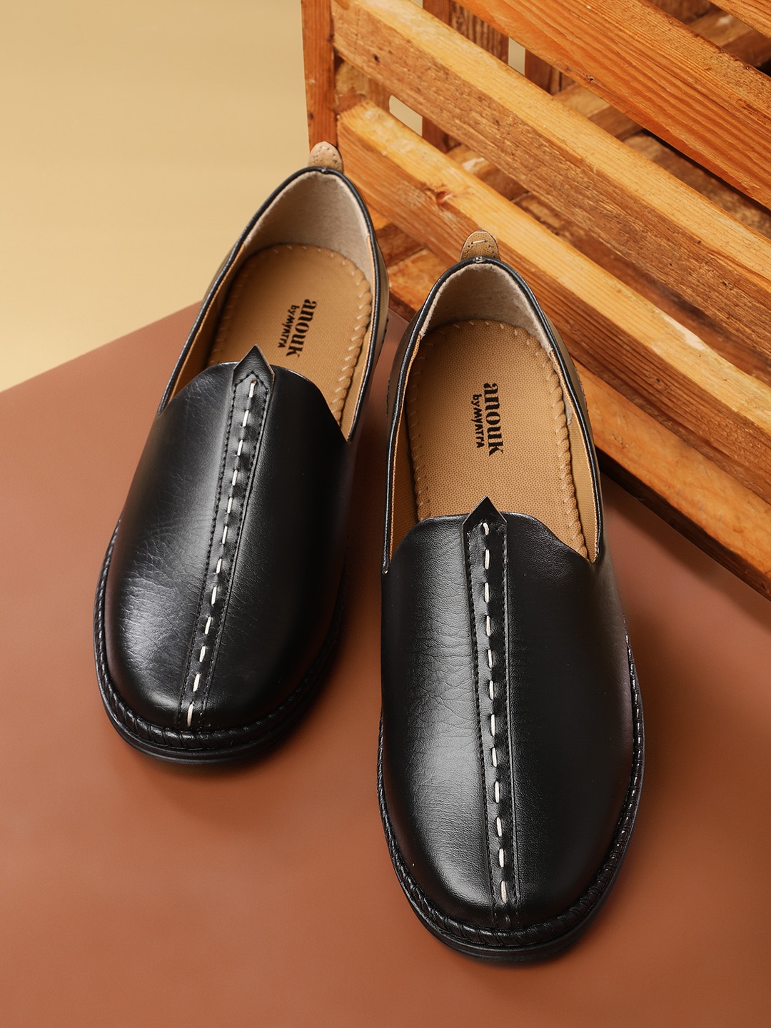 

Anouk Men Black Solid Slip-Ons with Thread Work Detail