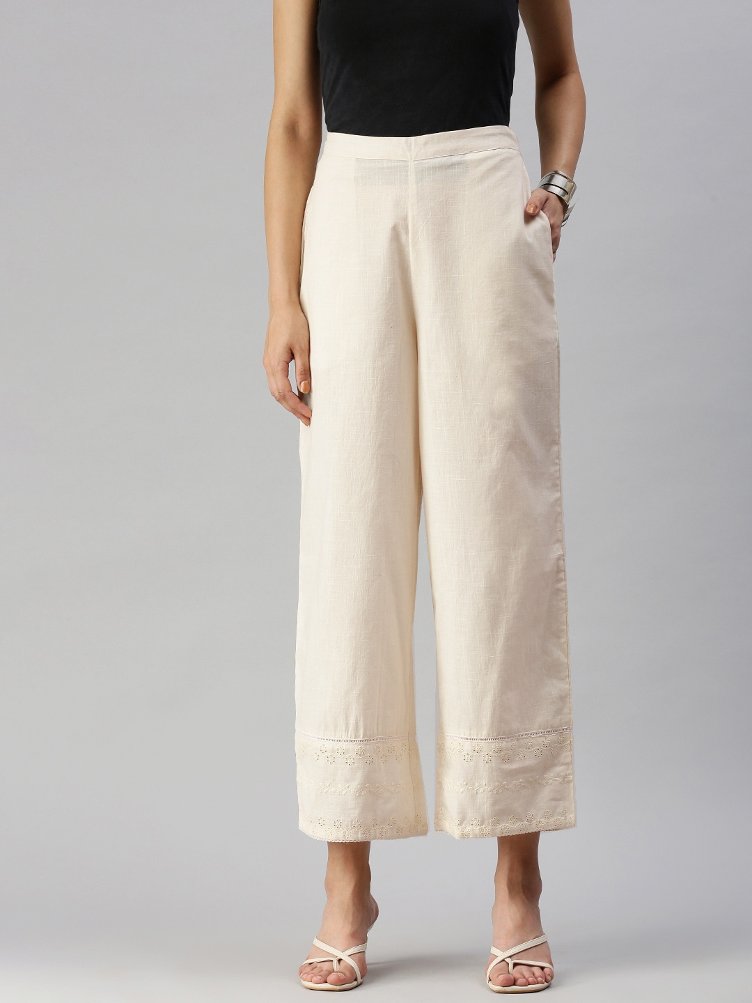 

Global Desi Women White Solid Straight Fit Trousers