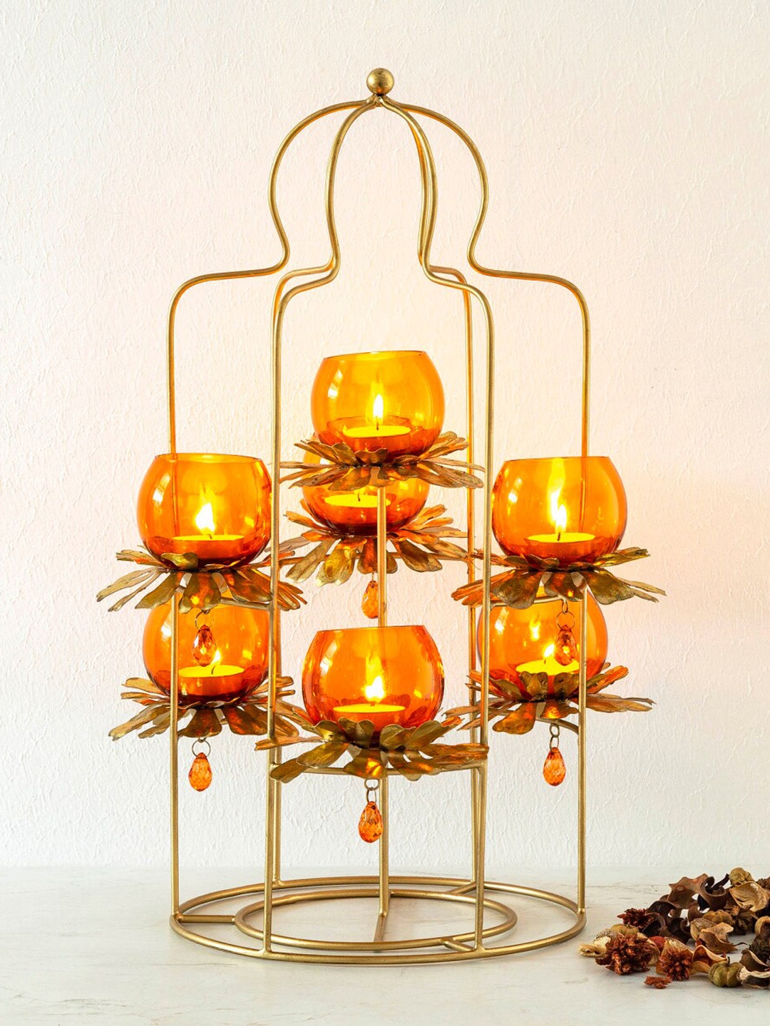 

Home Centre Orange & Gold-Toned Metal Candle Holder