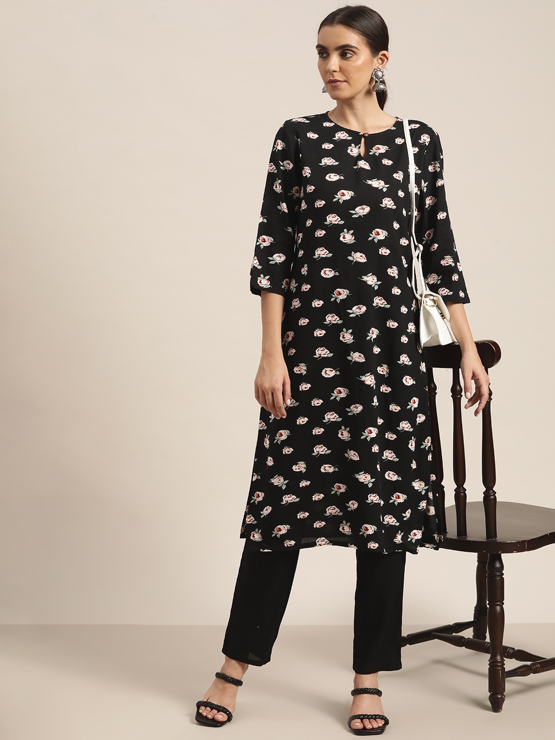 

Moda Rapido Women Black & White Floral Printed Kurta with Trousers