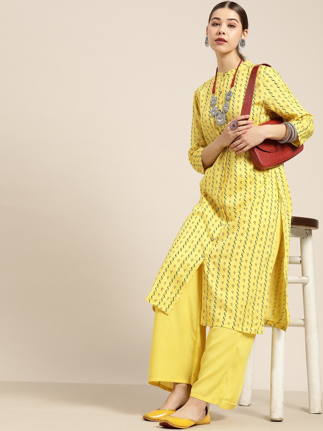 

Moda Rapido Women Yellow & Black Printed Kurta with Palazzos