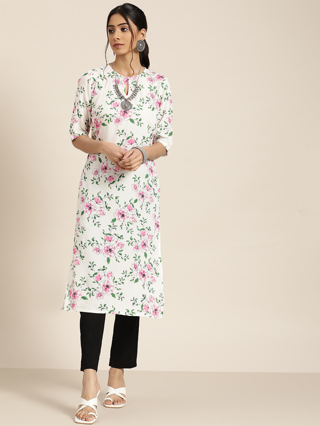 

Moda Rapido Women White & Black Floral Printed Kurta with Solid Trousers