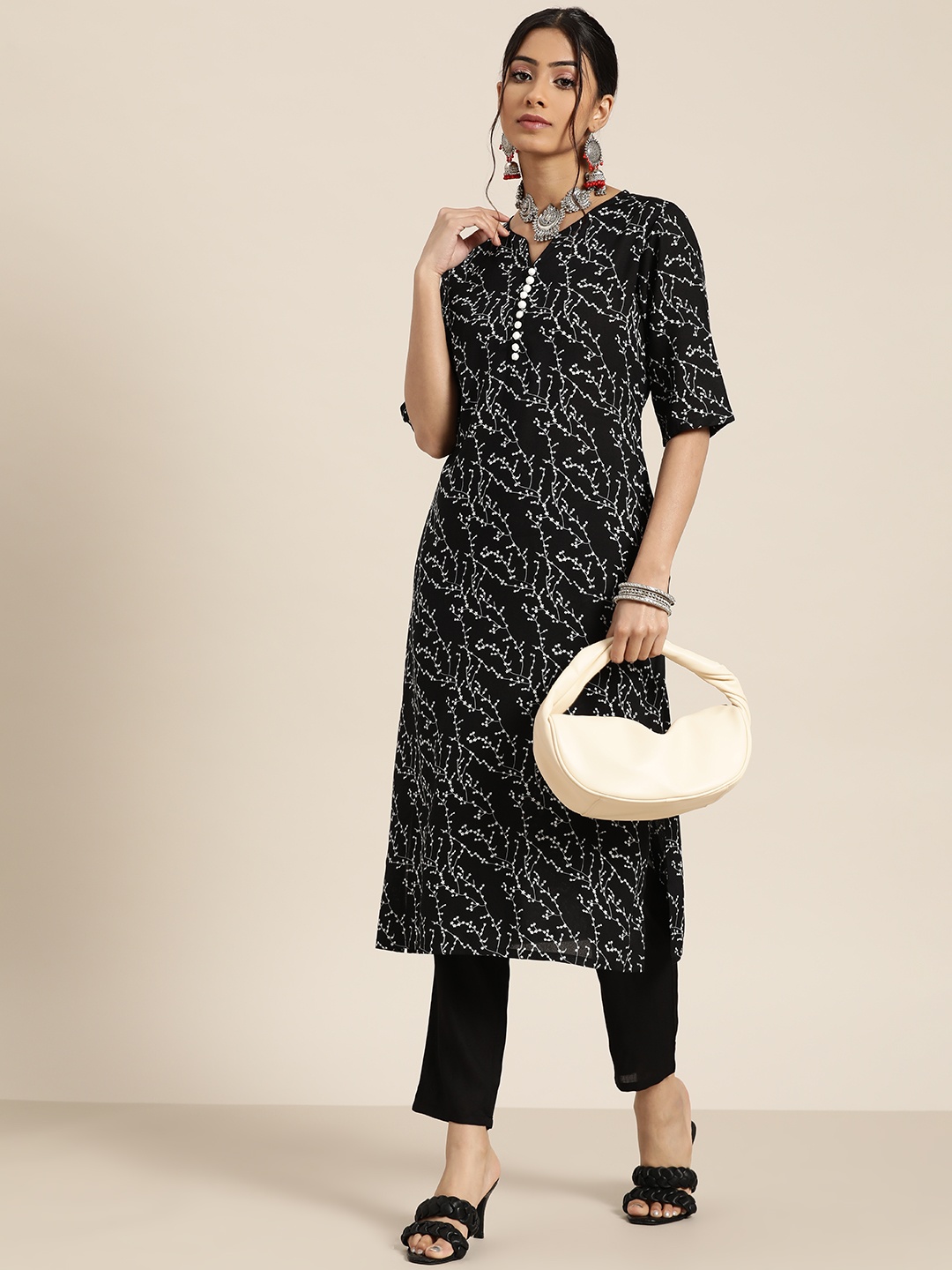 

Moda Rapido Women Black & White Floral Printed Kurta with Solid Trousers