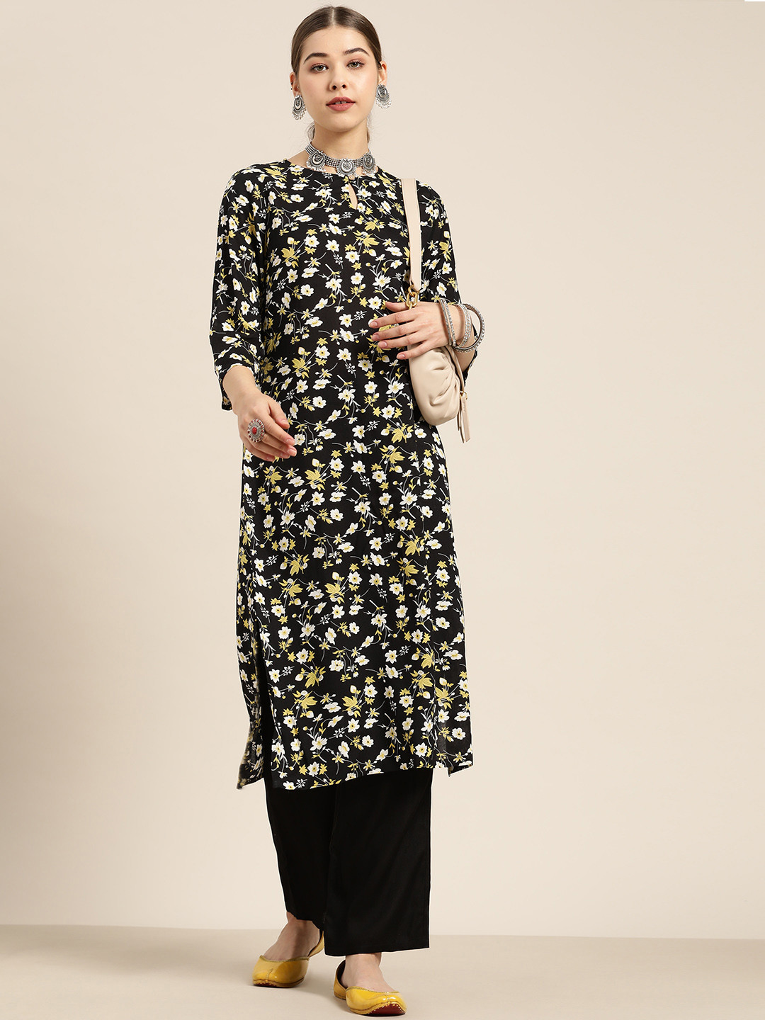 

Moda Rapido Women Black & White Floral Print Kurta with Palazzos