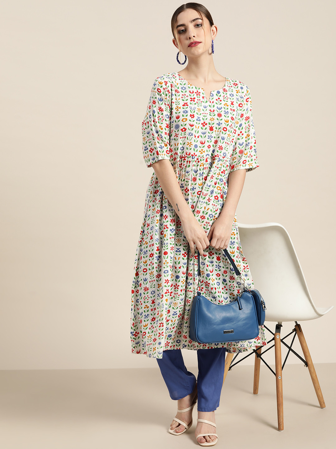 

Moda Rapido Women White & Blue Floral Printed A-Line Kurta with Trousers