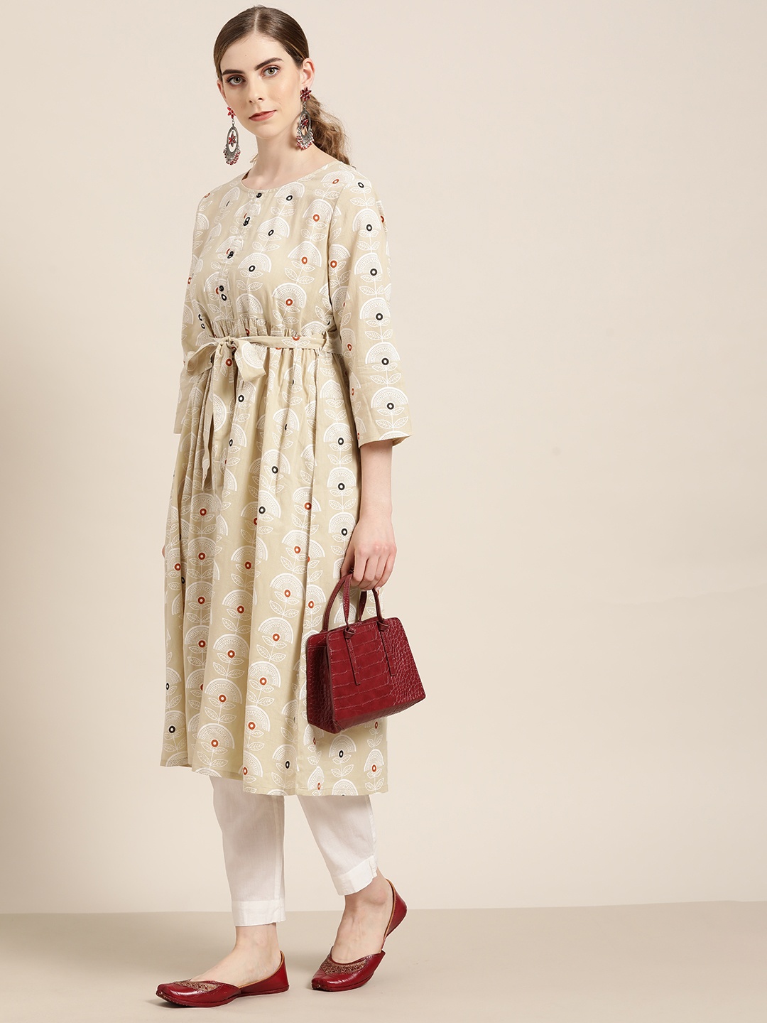 

Moda Rapido Women Beige & White Ethnic Motifs Print Cotton Pleated A-line Kurta with Belt