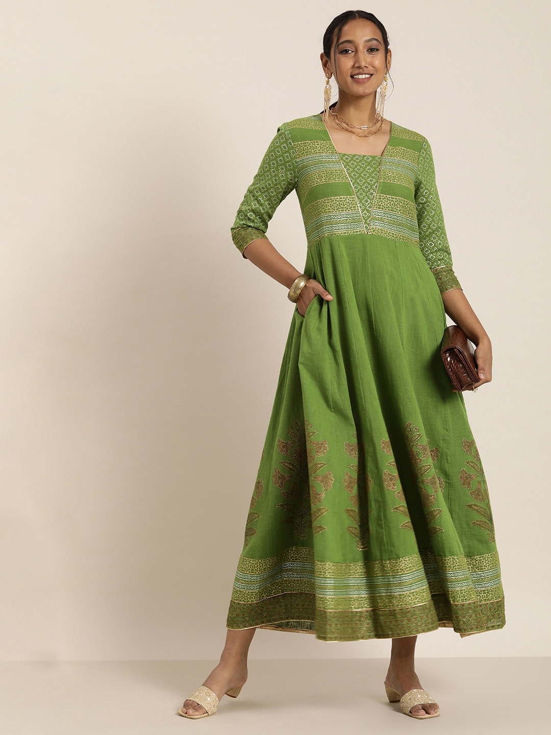 

Taavi Olive Green & Golden Cheriyal Festive Gold Khari Block Print A-Line Maxi Dress