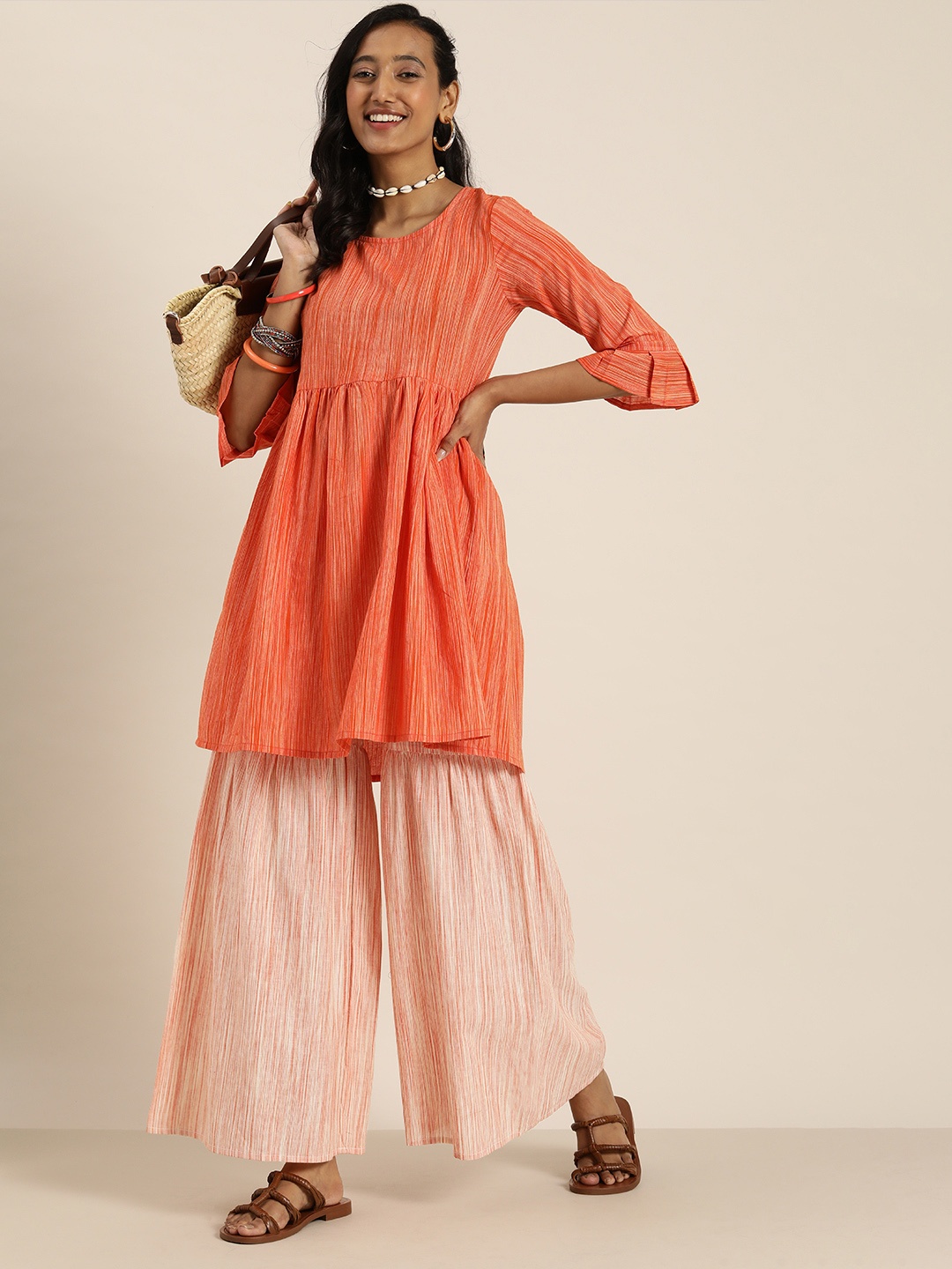

Taavi Women Orange Pleated Pure Cotton Woven Legacy Kurta with Sharara