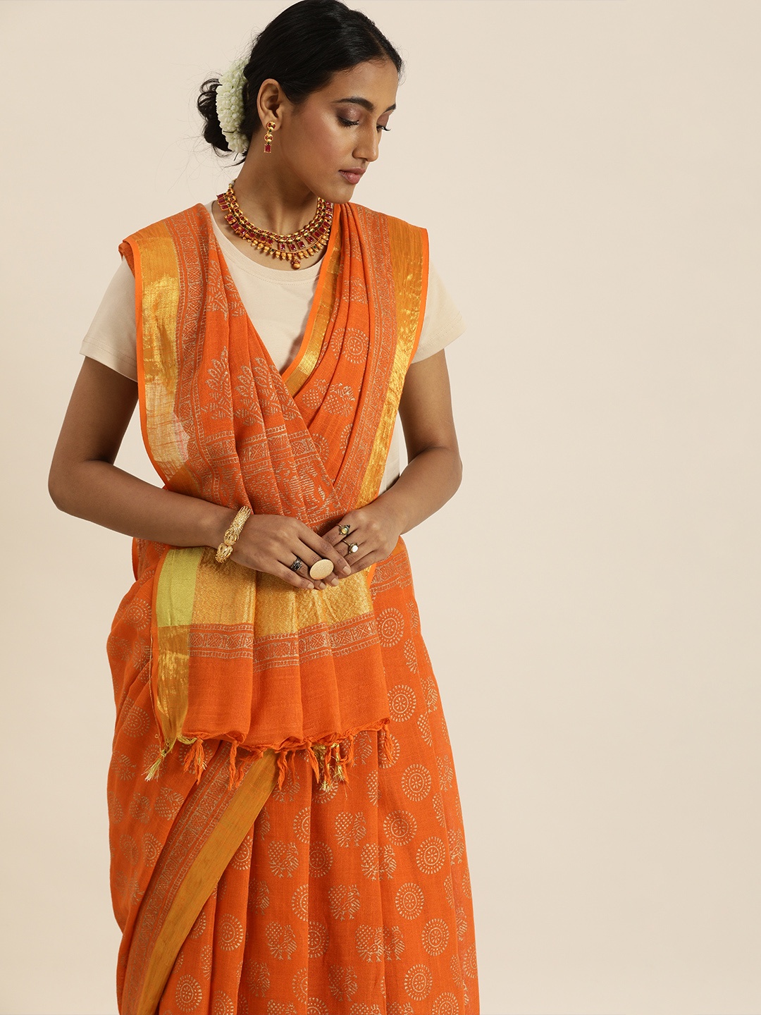 

Taavi Orange & Golden Festive Gold Khadi Print Sustainable Saree