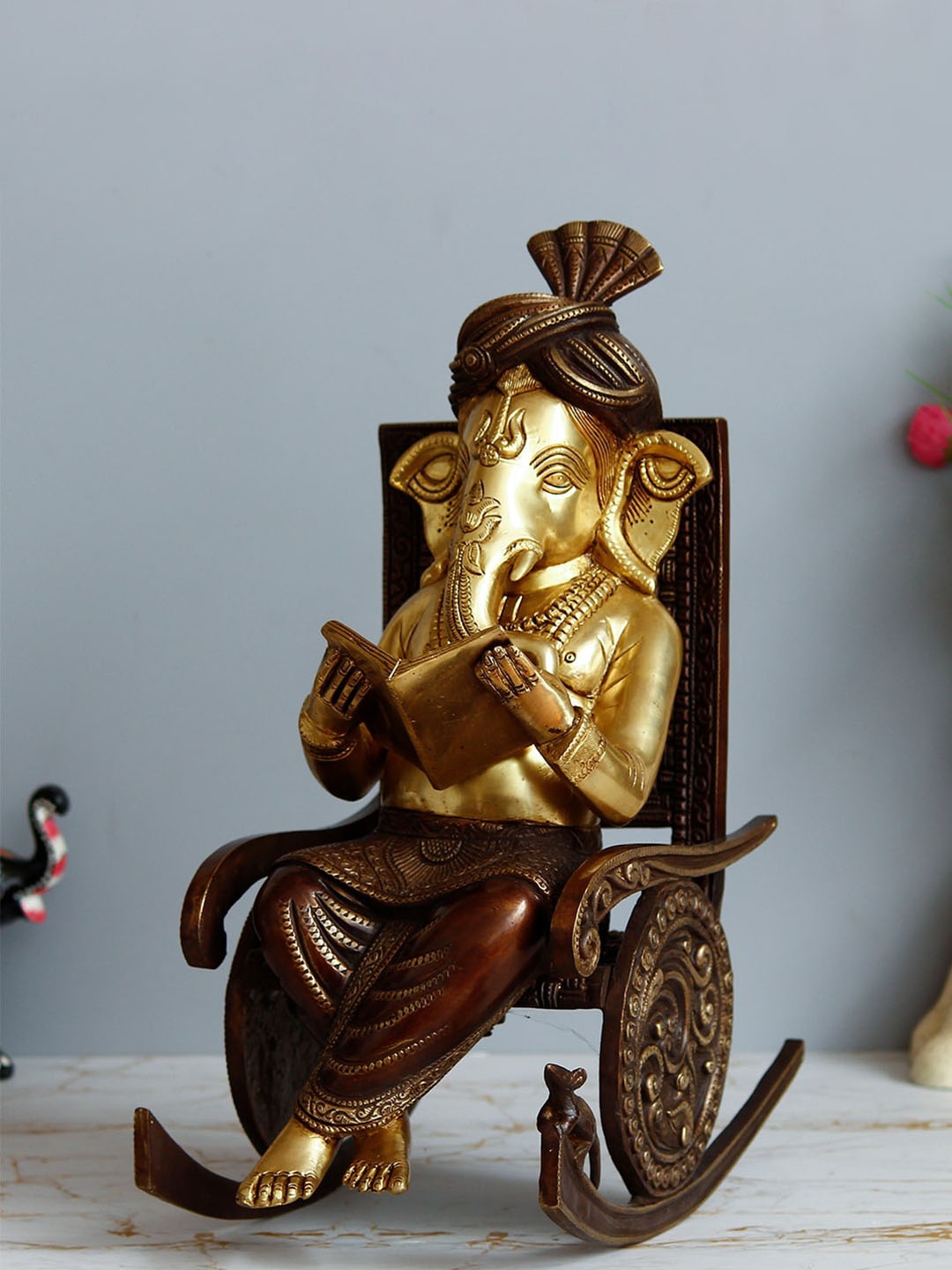 

eCraftIndia Gold Toned Handcrafted Antique Lord Ganesha Reading Book & Sitting On Rocking Chair Showpiece