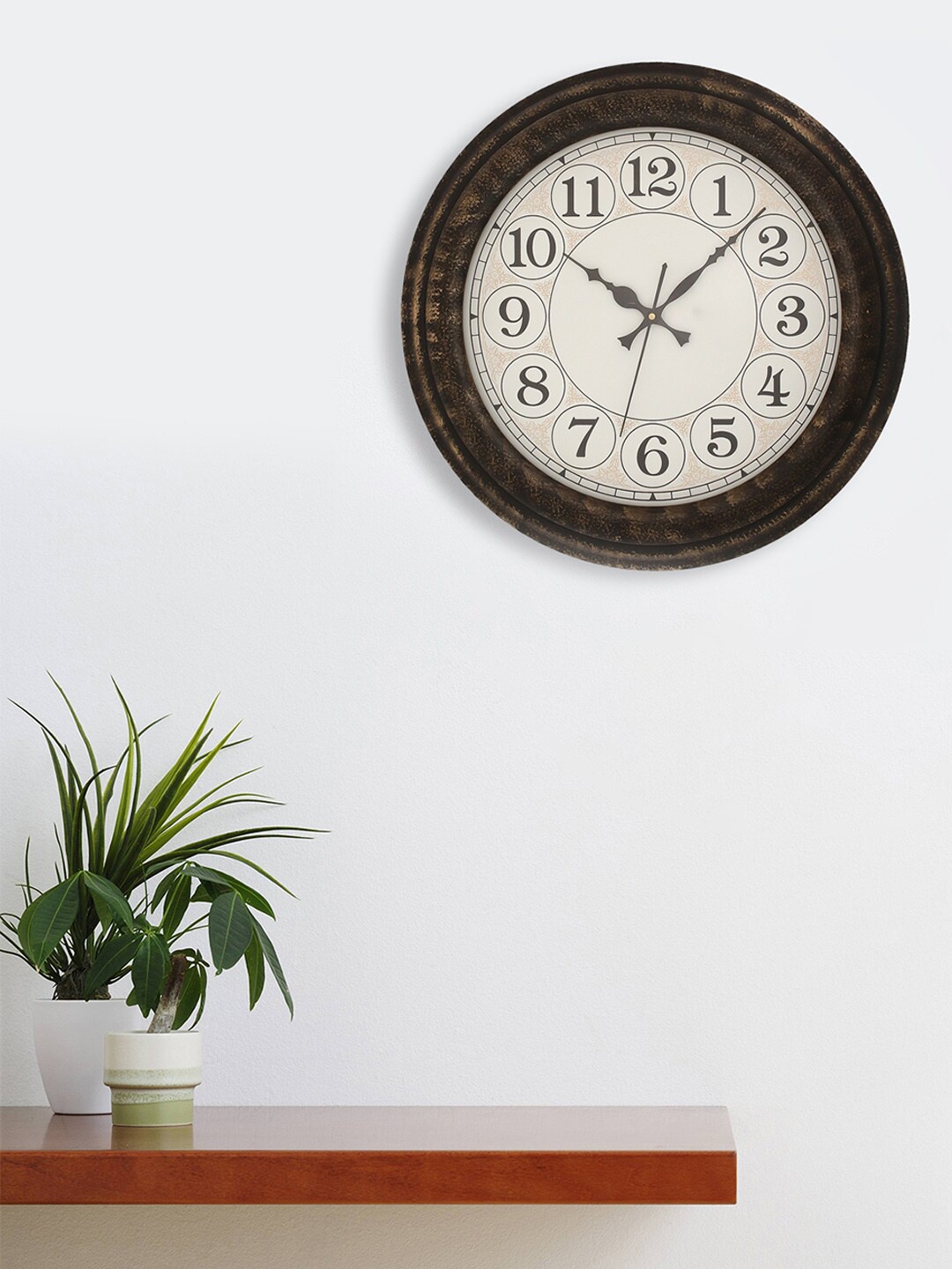 

eCraftIndia Gold-Toned & Black Traditional Wall Clock