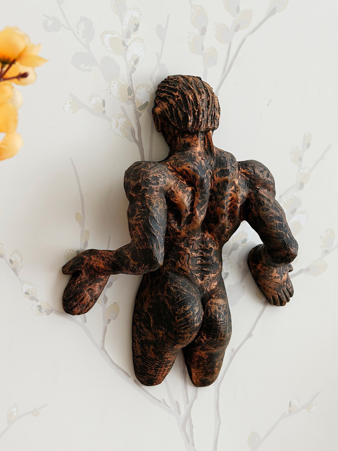 

eCraftIndia Brown Man Pushing Handcrafted Wall Decor