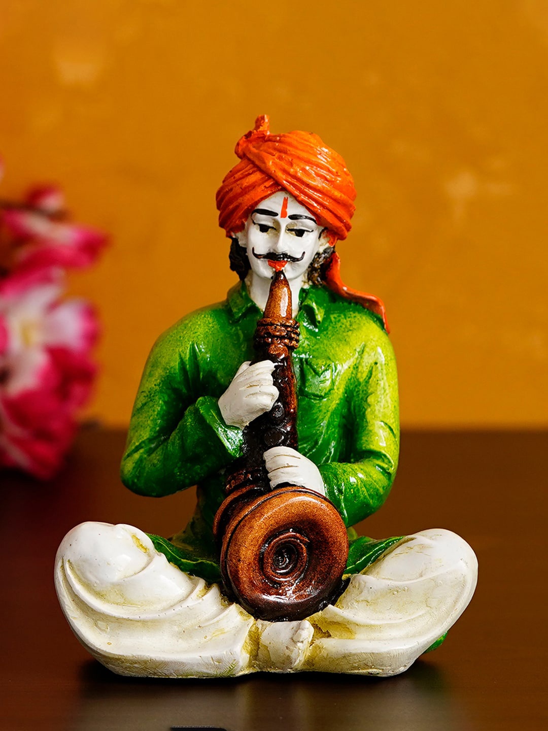 

eCraftIndia Green & White Rajasthani Man Playing Musical Instrument Showpiece