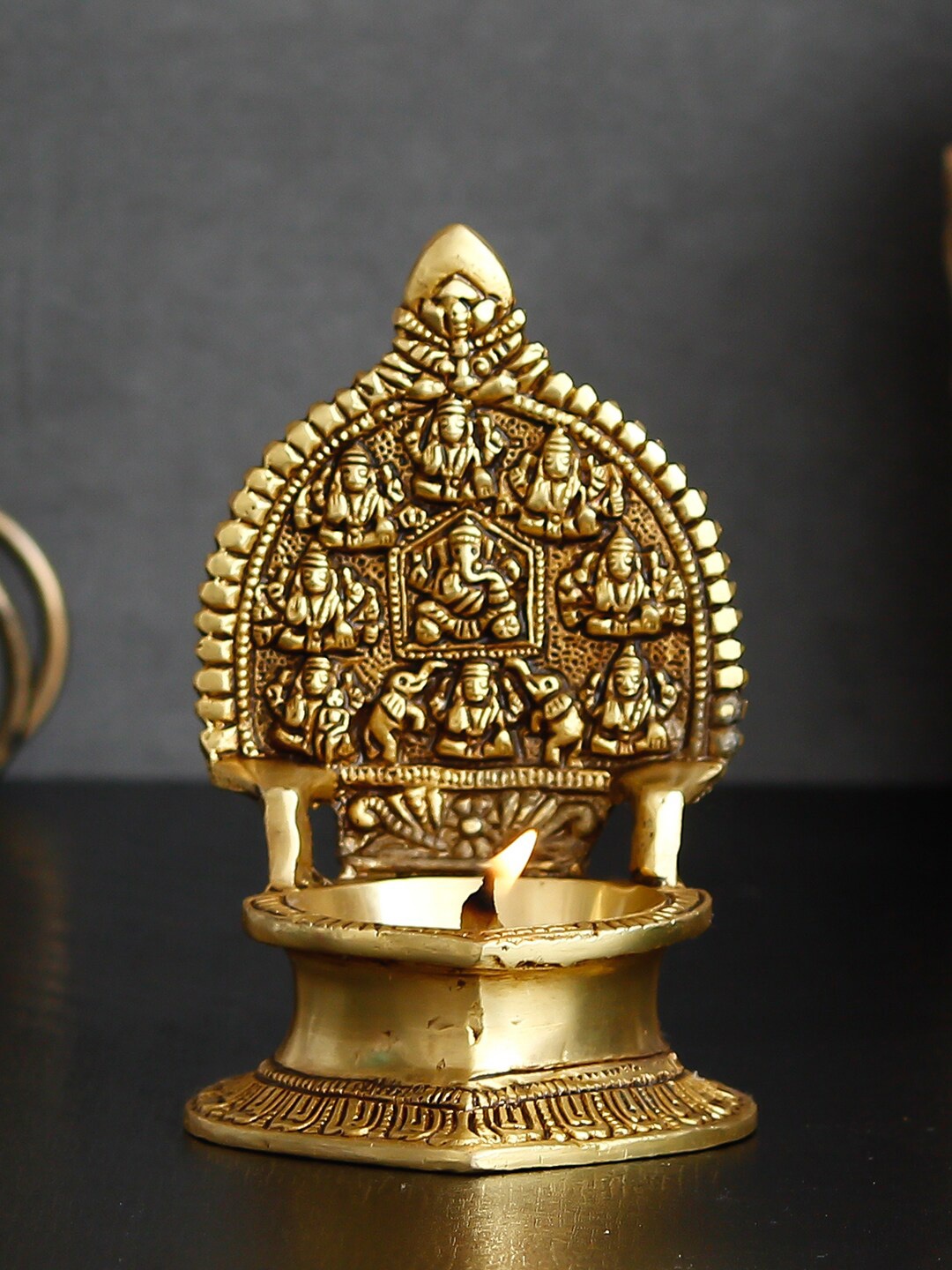 

eCraftIndia Gold-Toned 9 Avatars of Lord Ganesha Handcrafted Brass Figurine with Diya