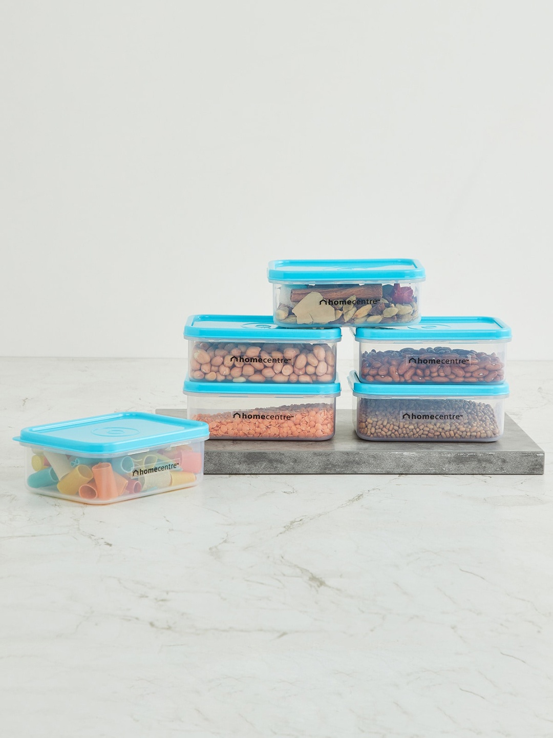 

Home Centre Set Of 6 Transparent & Blue Solid Storage Canisters